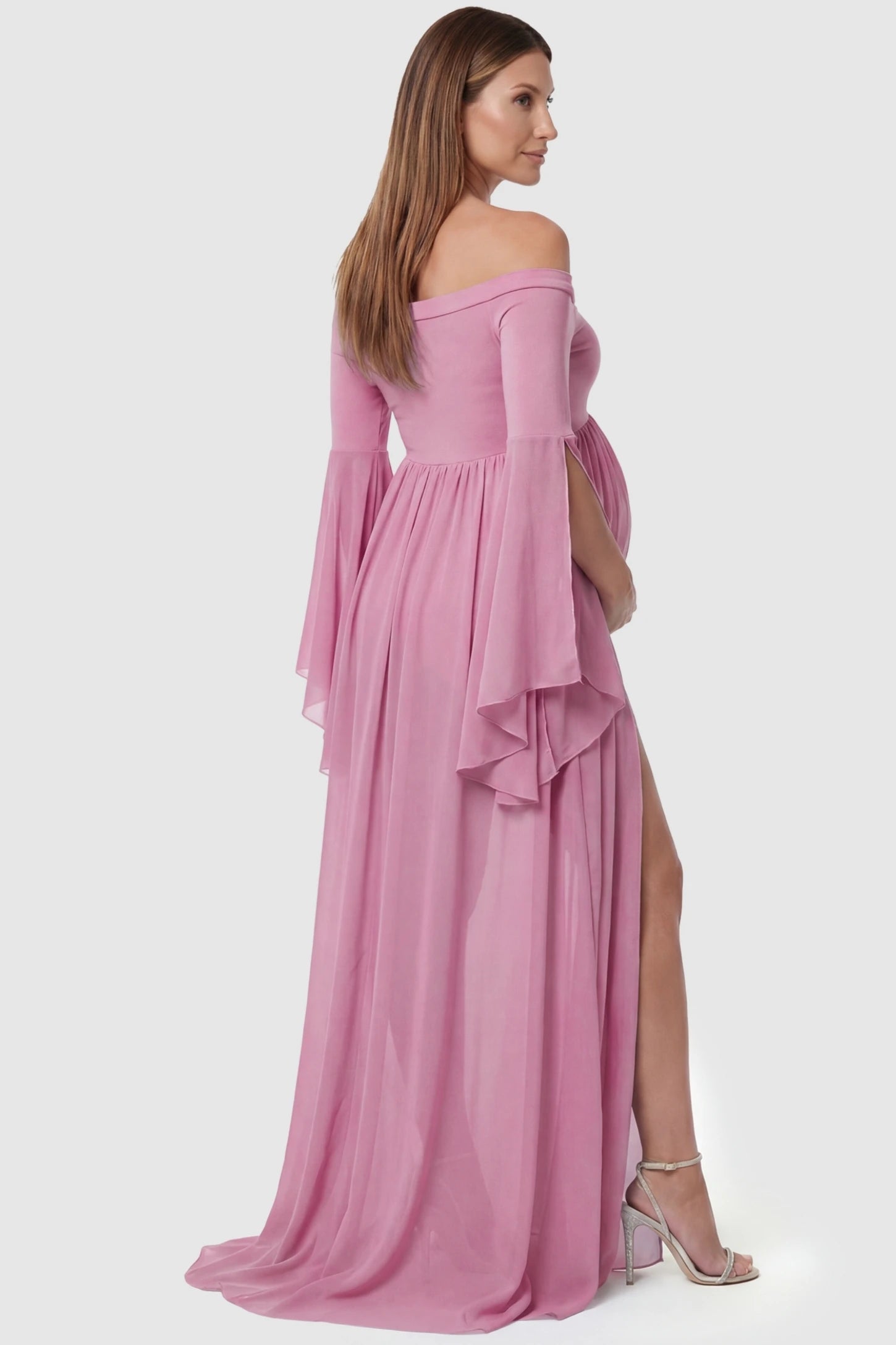 Off-the-Shoulder Long Train Maxi Maternity Dress Off-the-shoulder long train maxi maternity dress in lime pink featuring flowing chiffon silhouette in full body back view on a pregnant model