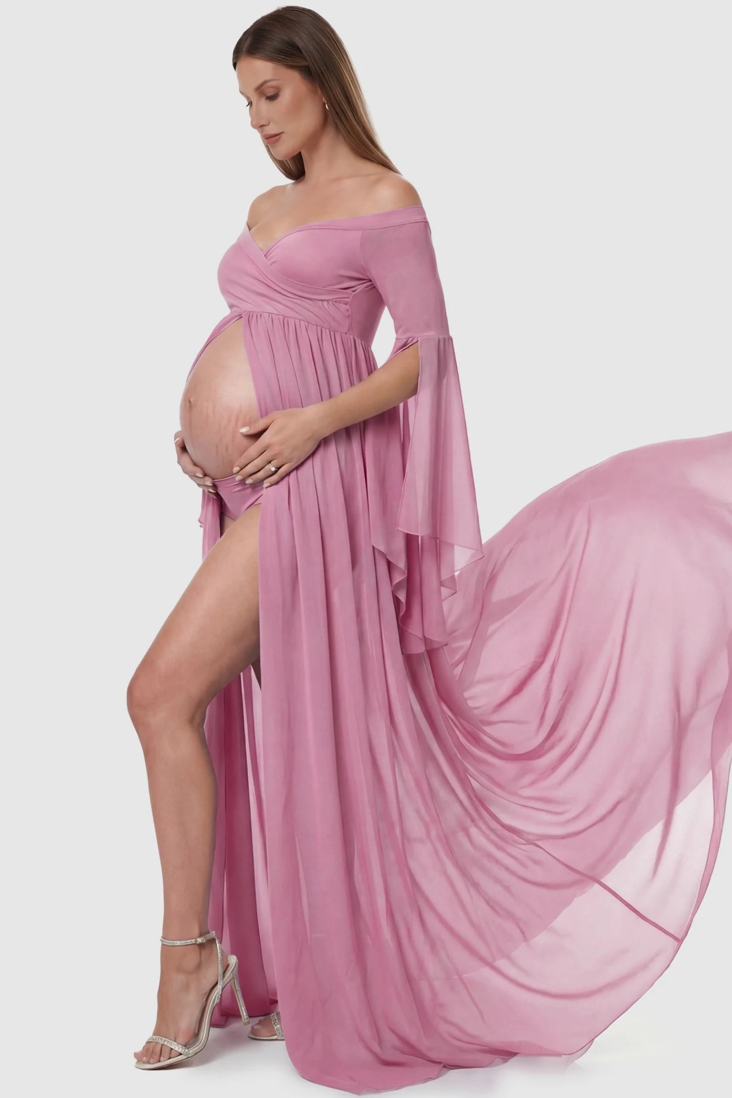 Off-the-Shoulder Long Train Maxi Maternity Dress Off-the-shoulder long train maxi maternity dress in lime pink featuring elegant off-shoulder in full body side view on a pregnant model