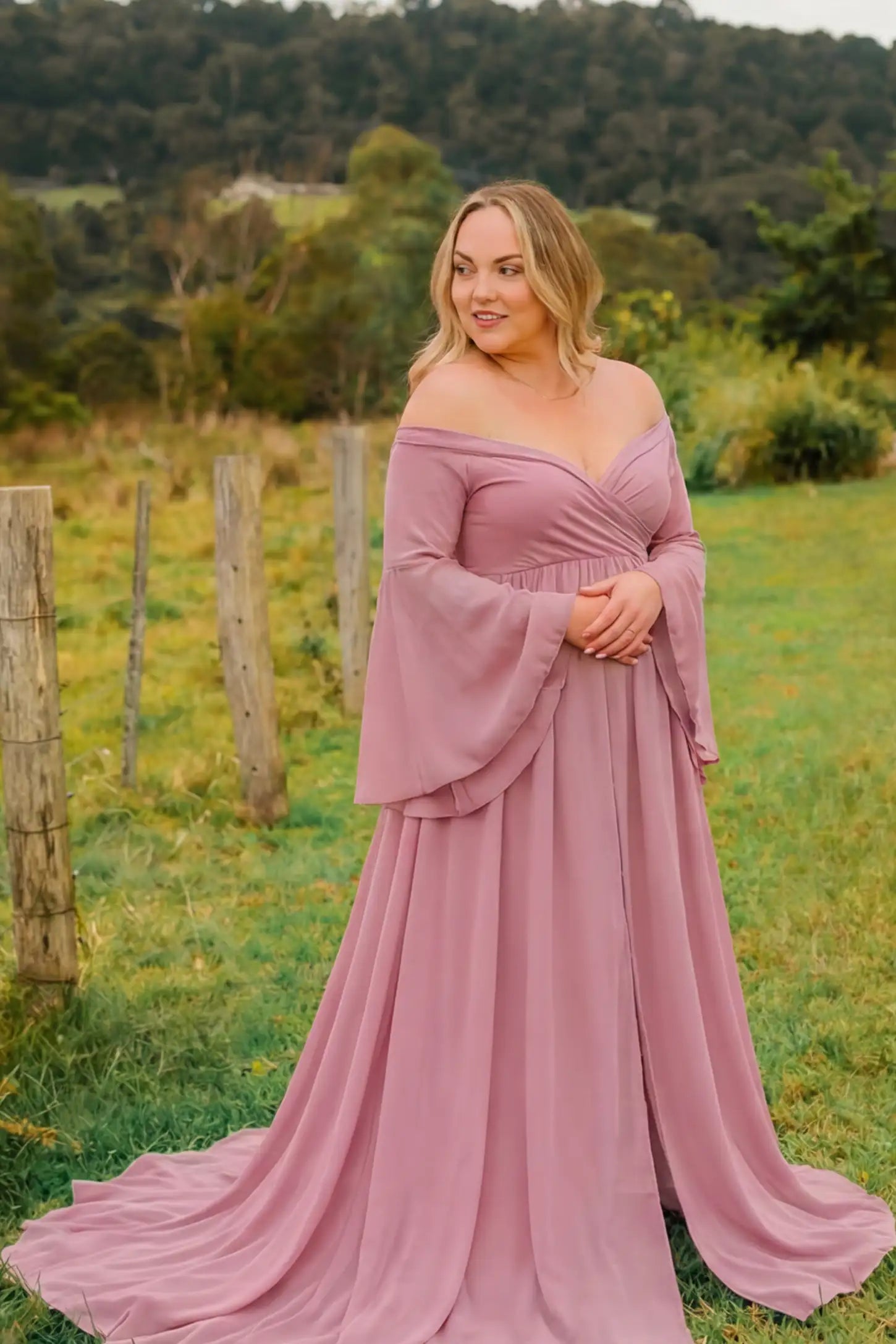 Off-the-Shoulder Long Train Maxi Maternity Dress Off-the-shoulder long train maxi maternity dress in lime pink featuring off-shoulder and long-train in full body front view on a editorial lifestyle model