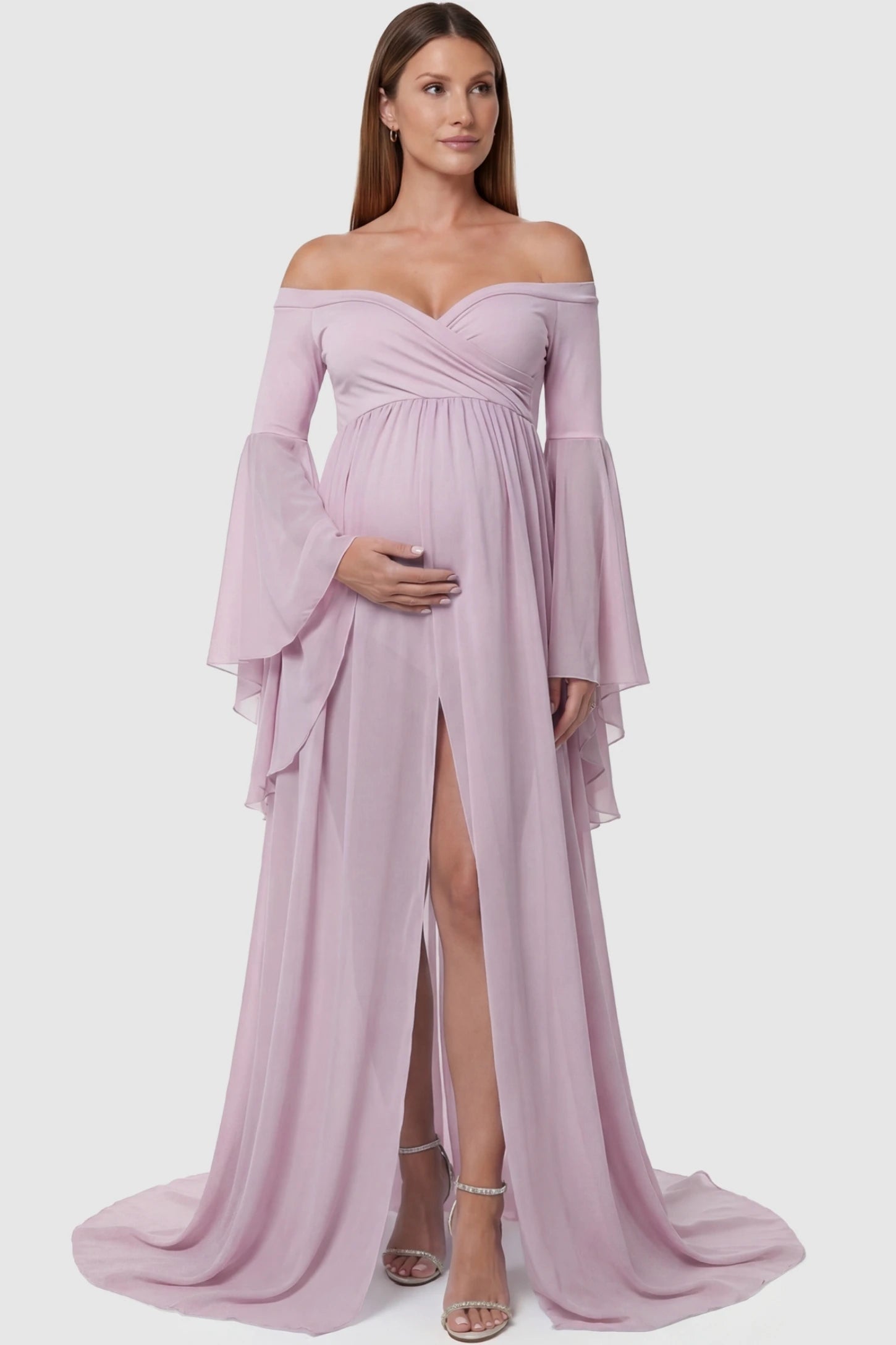 Off-the-Shoulder Long Train Maxi Maternity Dress Off-the-shoulder long train maxi maternity dress in pink featuring a high front-slit in full body front view on a pregnant model