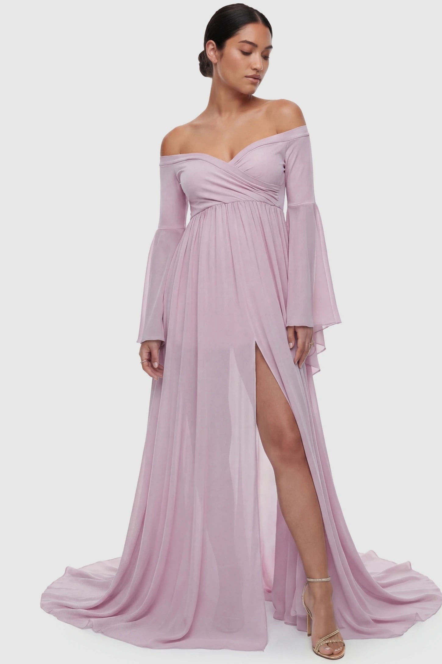 Off-the-Shoulder Long Train Maxi Maternity Dress Off-the-shoulder long train maxi maternity dress in pink featuring off-shoulder & front-slit in full body front view on a postpartum model
