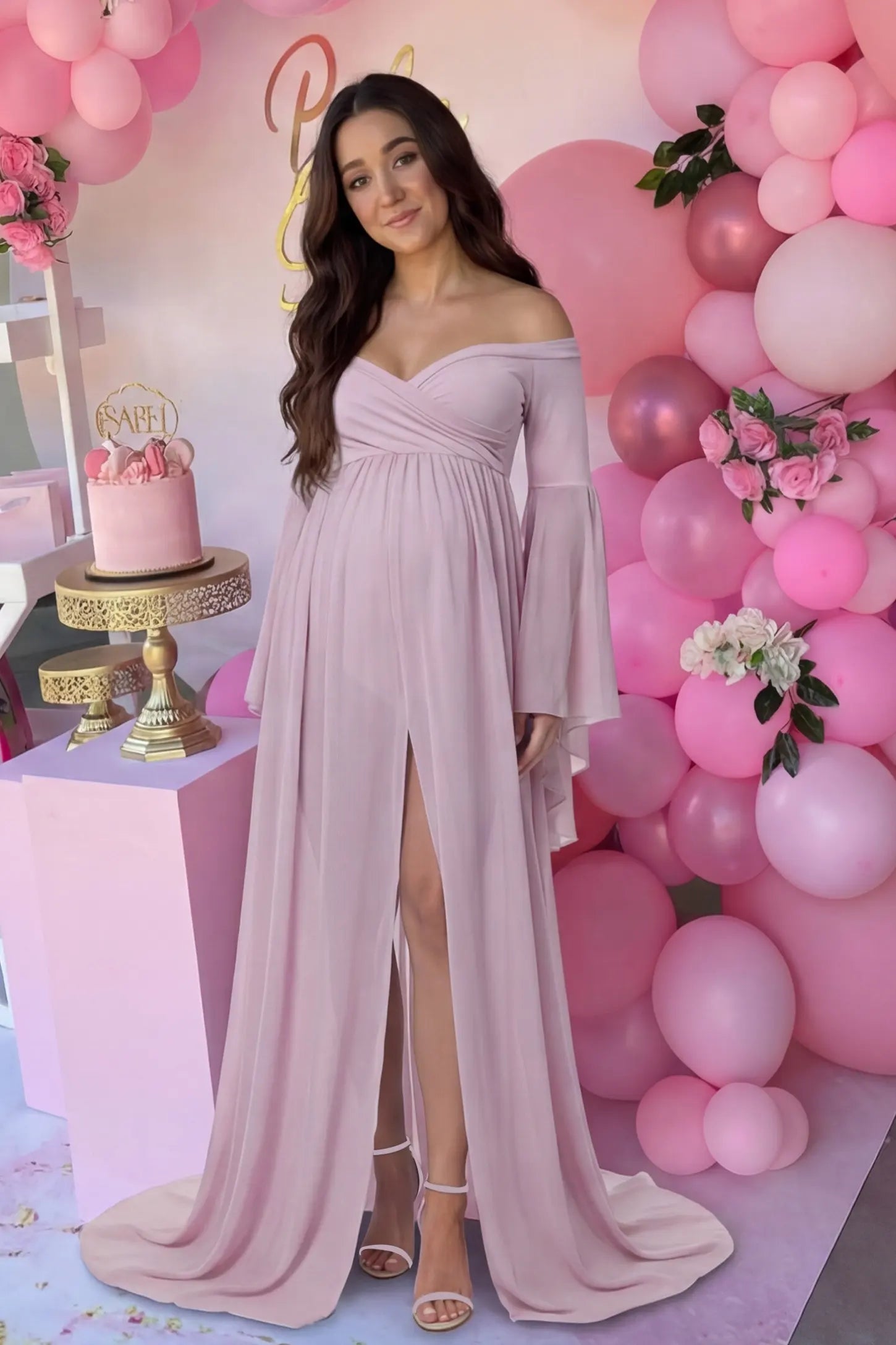 Off-the-Shoulder Long Train Maxi Maternity Dress Off-the-shoulder long train maxi maternity dress in pink featuring long bell sleeves in front view on a UGC model