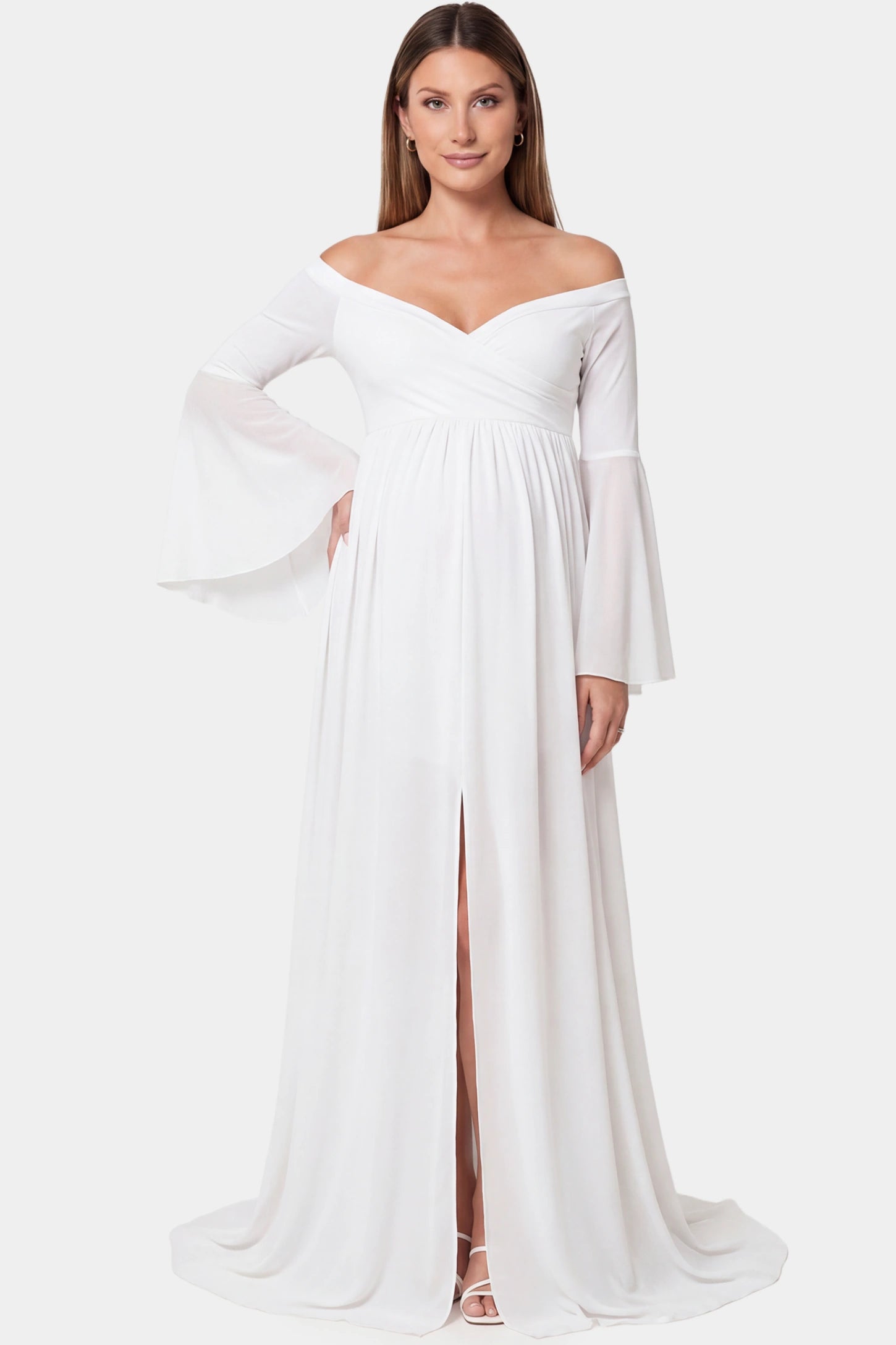 Off-the-shoulder long train maxi maternity dress in white featuring flowing chiffon silhouette in full body front view on a pregnant model