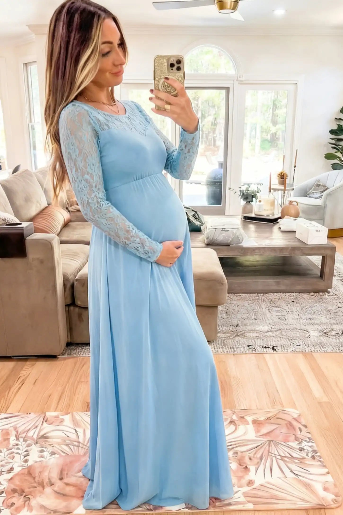 Acrylic Lace Long Sleeve Floor-Length Maternity Dress Acrylic Lace Long Sleeve Floor-Length Maternity Dress in Light Blue featuring a round neck on a side-facing pregnant model.
