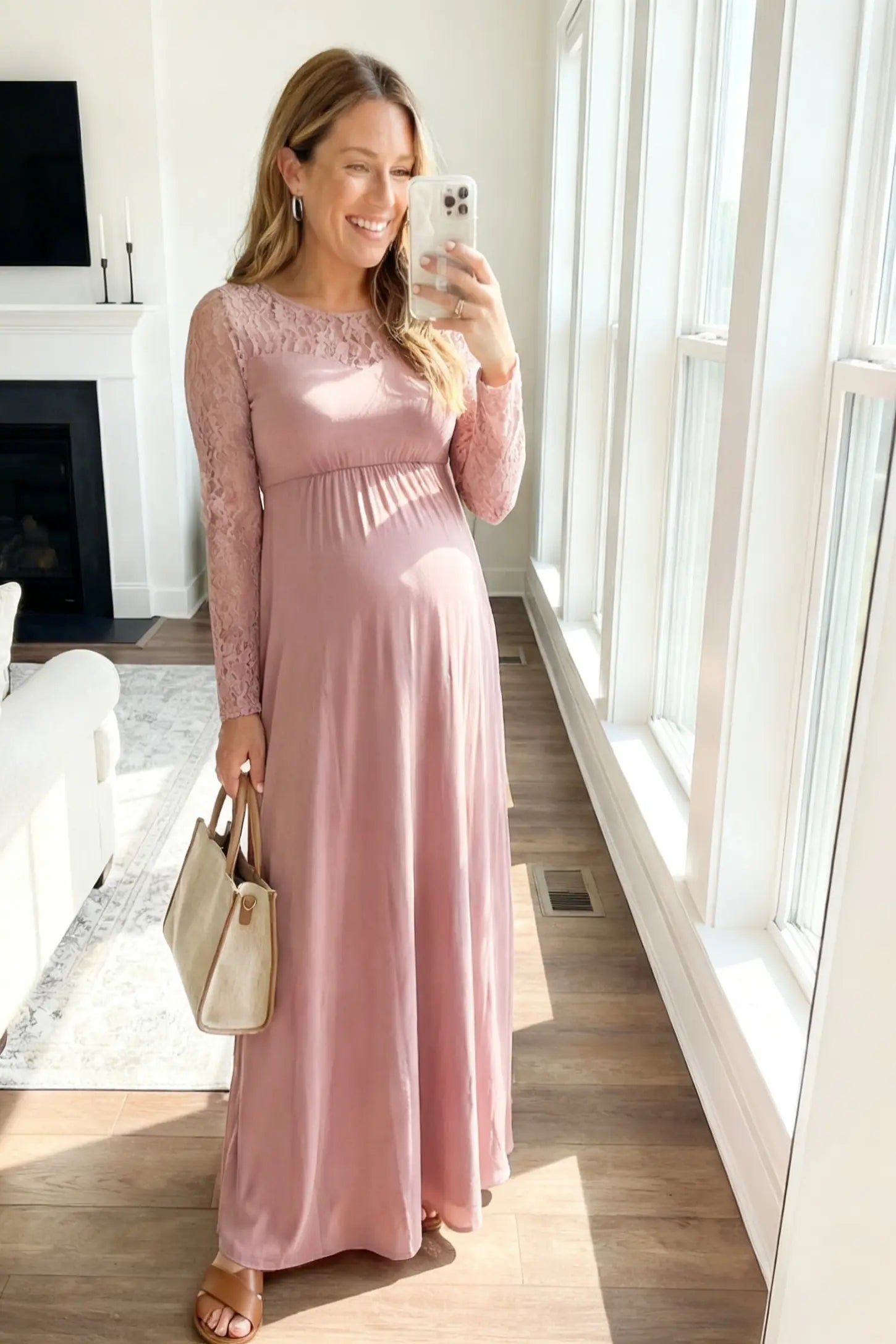 Acrylic Lace Long Sleeve Floor-Length Maternity Dress Acrylic Lace Long Sleeve Floor-Length Maternity Dress in Pink featuring a round neck on a pregnant model.