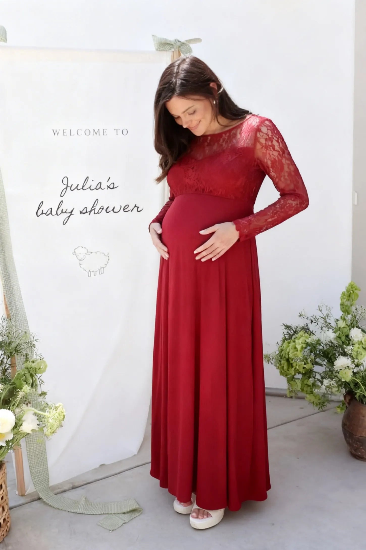 Acrylic Lace Long Sleeve Floor-Length Maternity Dress Acrylic Lace Long Sleeve Floor-Length Maternity Dress in Red featuring a round neck on a pregnant model.