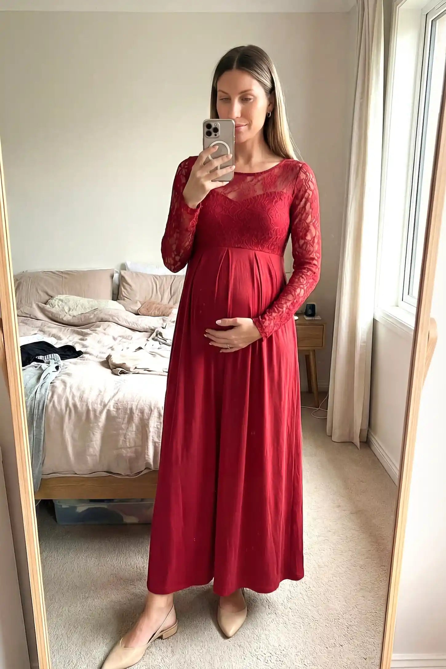 Acrylic Lace Long Sleeve Floor-Length Maternity Dress Acrylic Lace Long Sleeve Floor-Length Maternity Dress in Red featuring a round neck on a pregnant model.