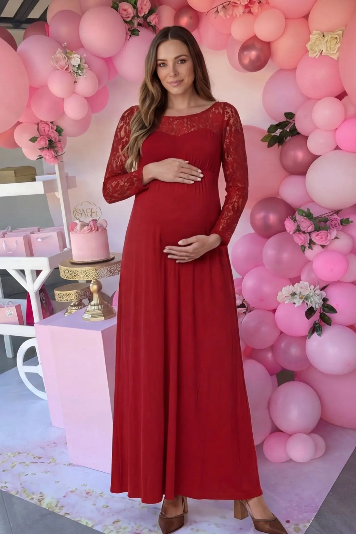 Acrylic Lace Long Sleeve Floor-Length Maternity Dress Acrylic Lace Long Sleeve Floor-Length Maternity Dress in Red featuring a round neck on a pregnant model.