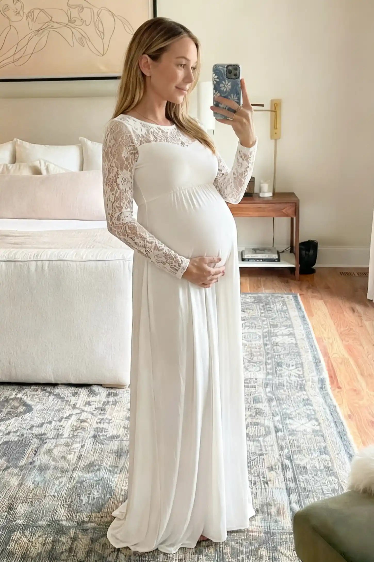 Acrylic Lace Long Sleeve Floor-Length Maternity Dress Acrylic Lace Long Sleeve Floor-Length Maternity Dress in Wihite featuring a round neck on a pregnant model.