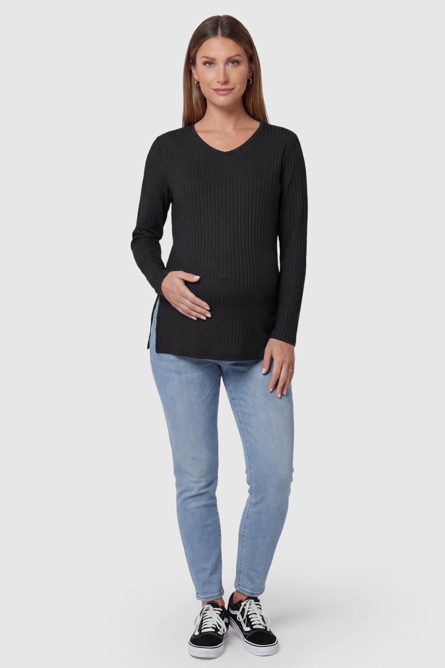 Ribbed V-Neck Longline Maternity Top Ribbed V-Neck Longline Maternity Top in Black featuring a relaxed longline tunic silhouette on pregnant model, full body