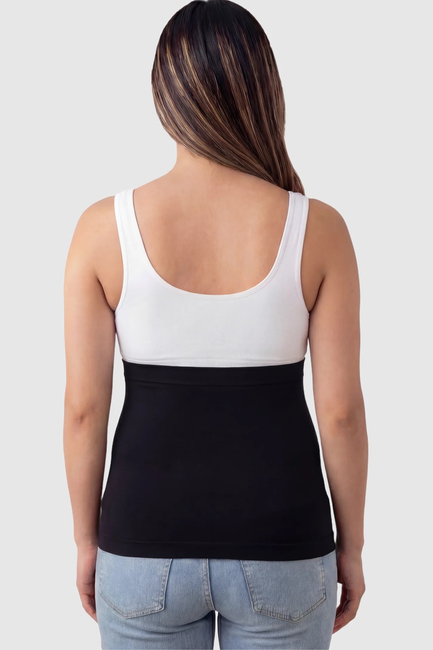 Seamless Support Maternity Belly Band Seamless Support Maternity Belly Band in black featuring wide high-rise fit and seamless tubular design on pregnant model.
