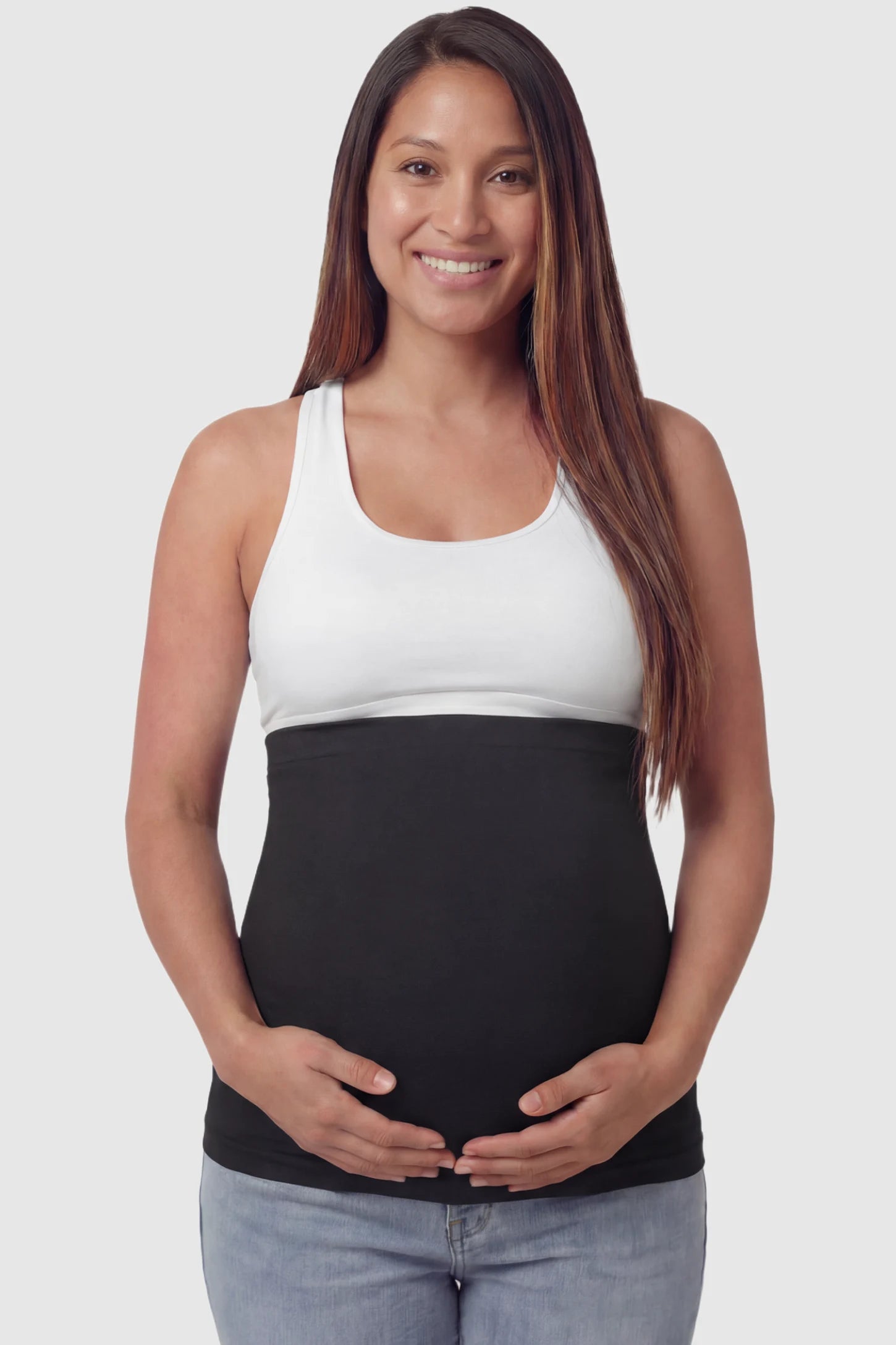 Seamless Support Maternity Belly Band in black featuring wide high-rise fit and seamless tubular design on pregnant model.