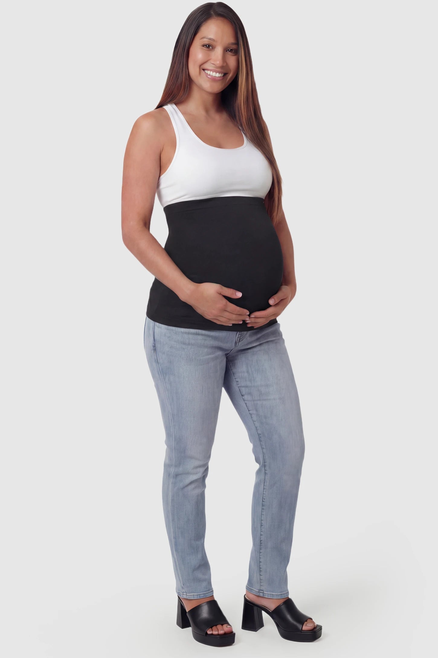 Seamless Support Maternity Belly Band Seamless Support Maternity Belly Band in black featuring wide high-rise fit and seamless tubular design on pregnant model.