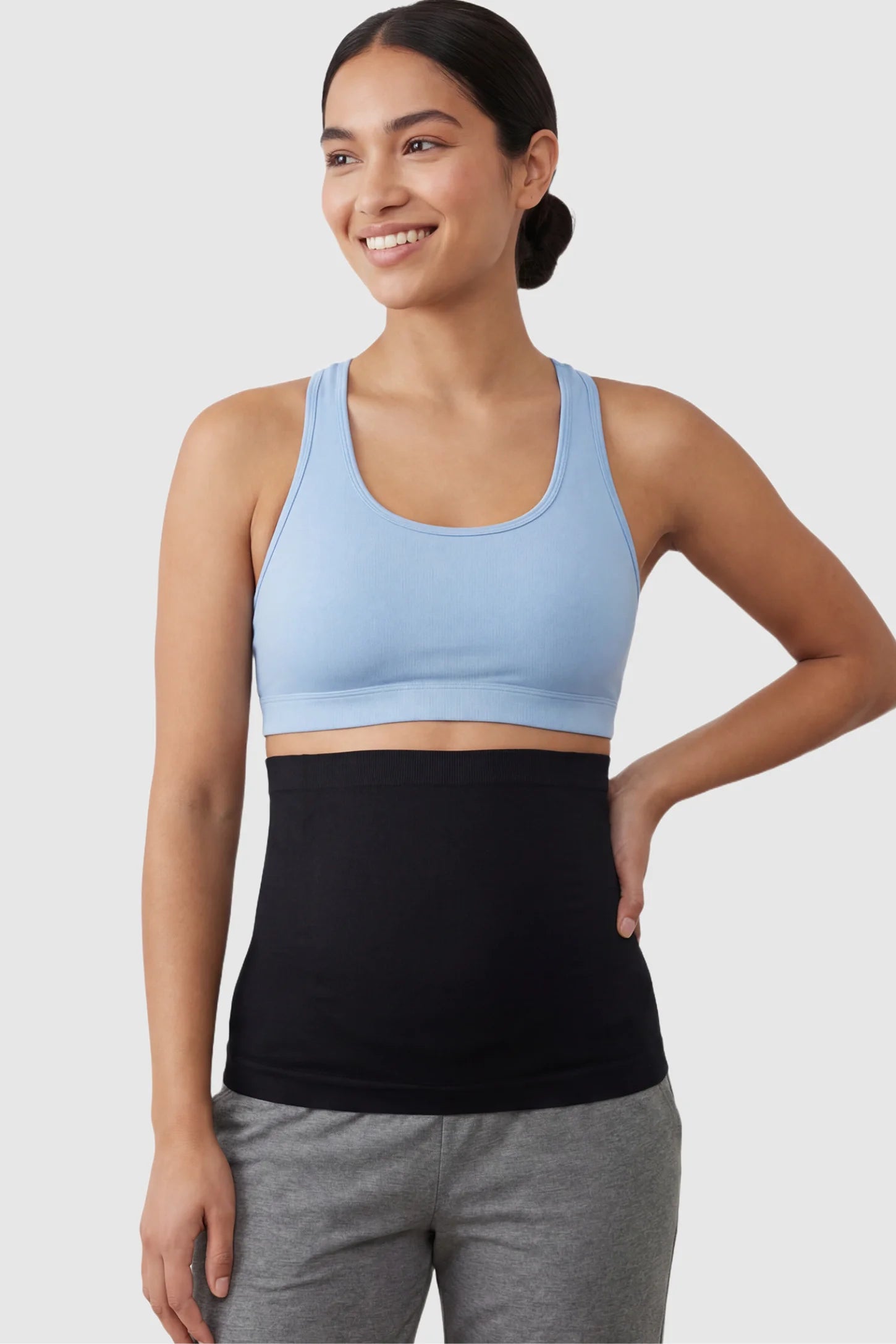 Seamless Support Maternity Belly Band Seamless Support Maternity Belly Band in black featuring wide high-rise fit and seamless tubular design on non pregnant model.