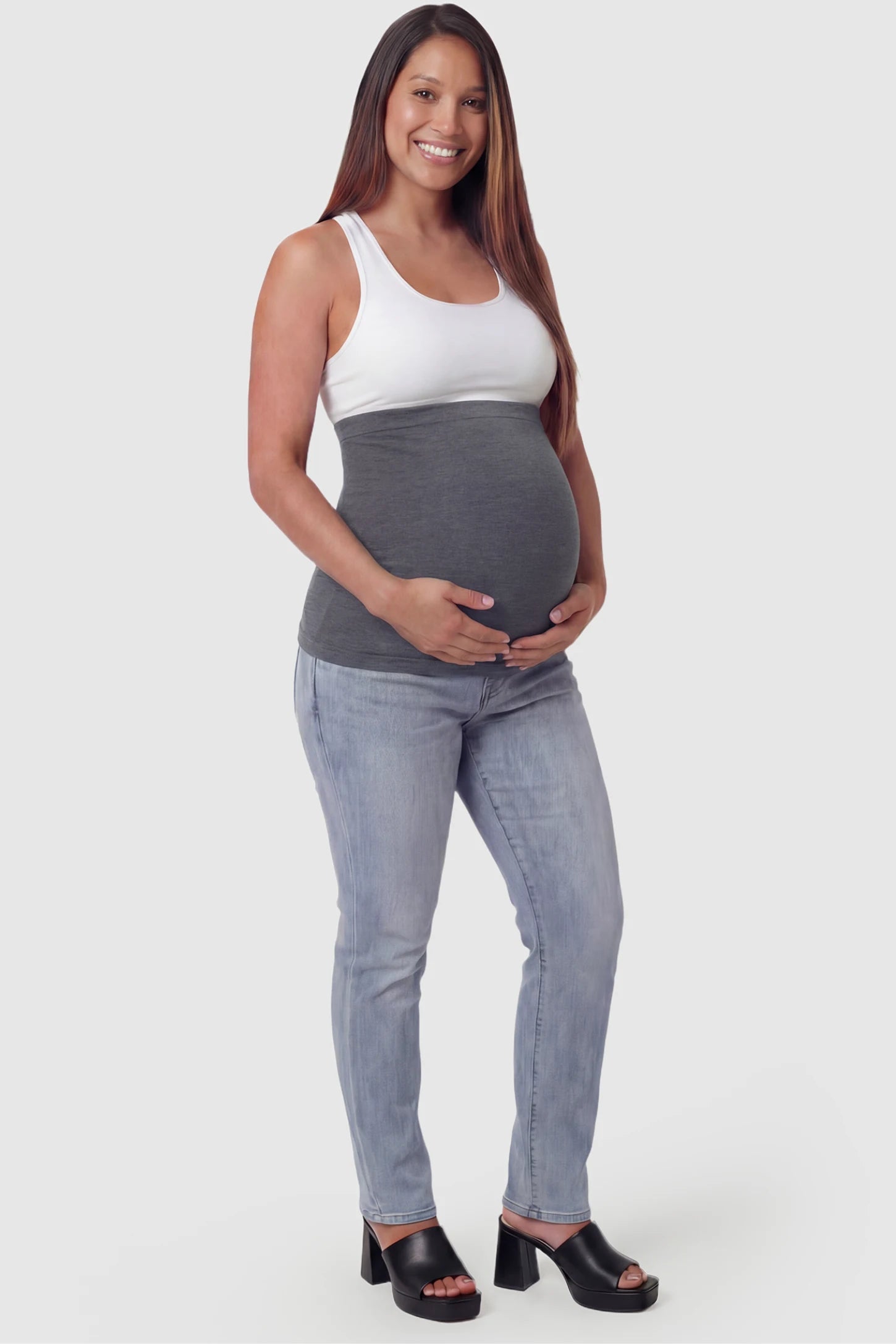 Seamless Support Maternity Belly Band Seamless Support Maternity Belly Band in dark gray featuring wide high-rise fit and seamless tubular design on pregnant model.