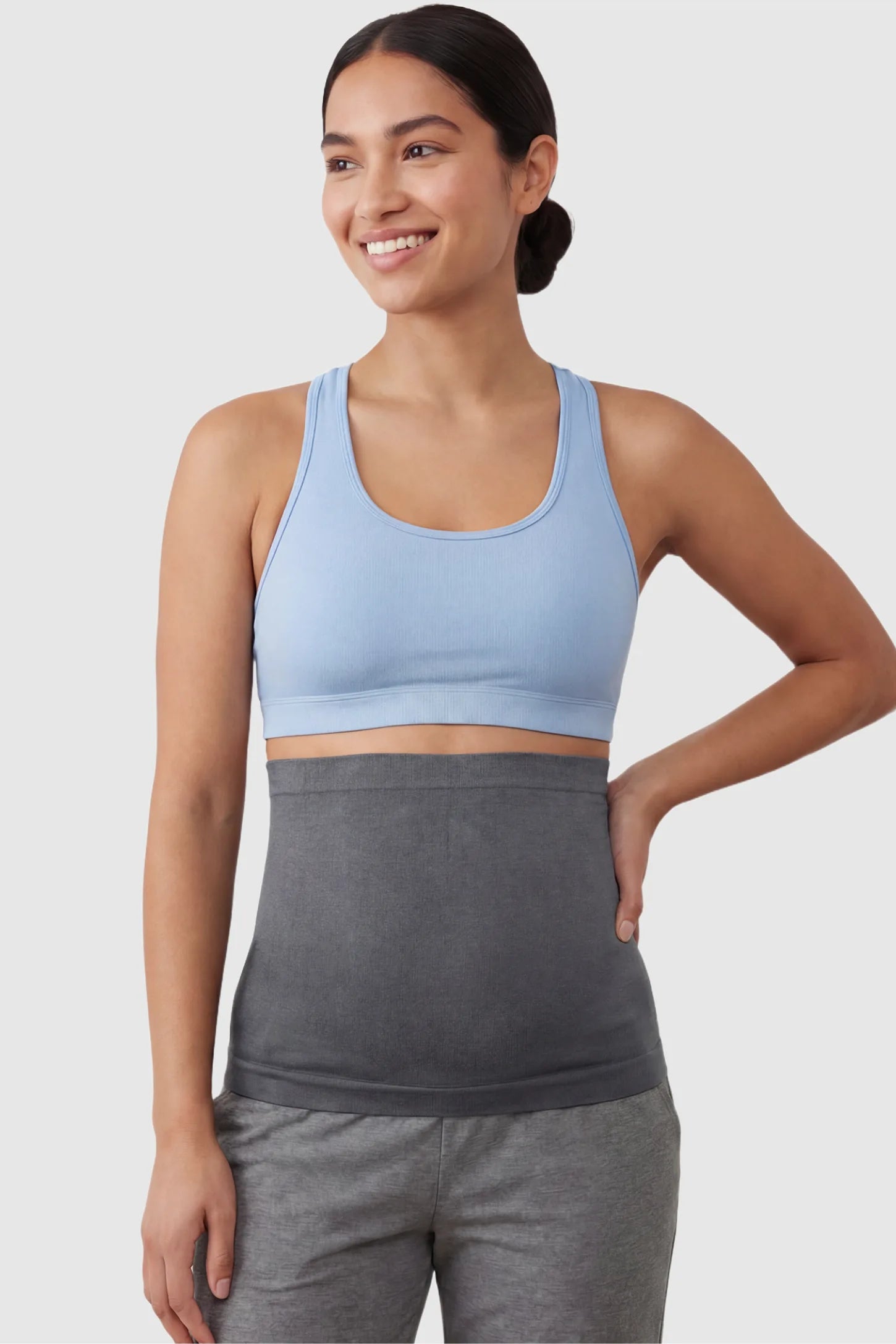 Seamless Support Maternity Belly Band Seamless Support Maternity Belly Band in dark gray featuring wide high-rise fit and seamless tubular design on non pregnant model.