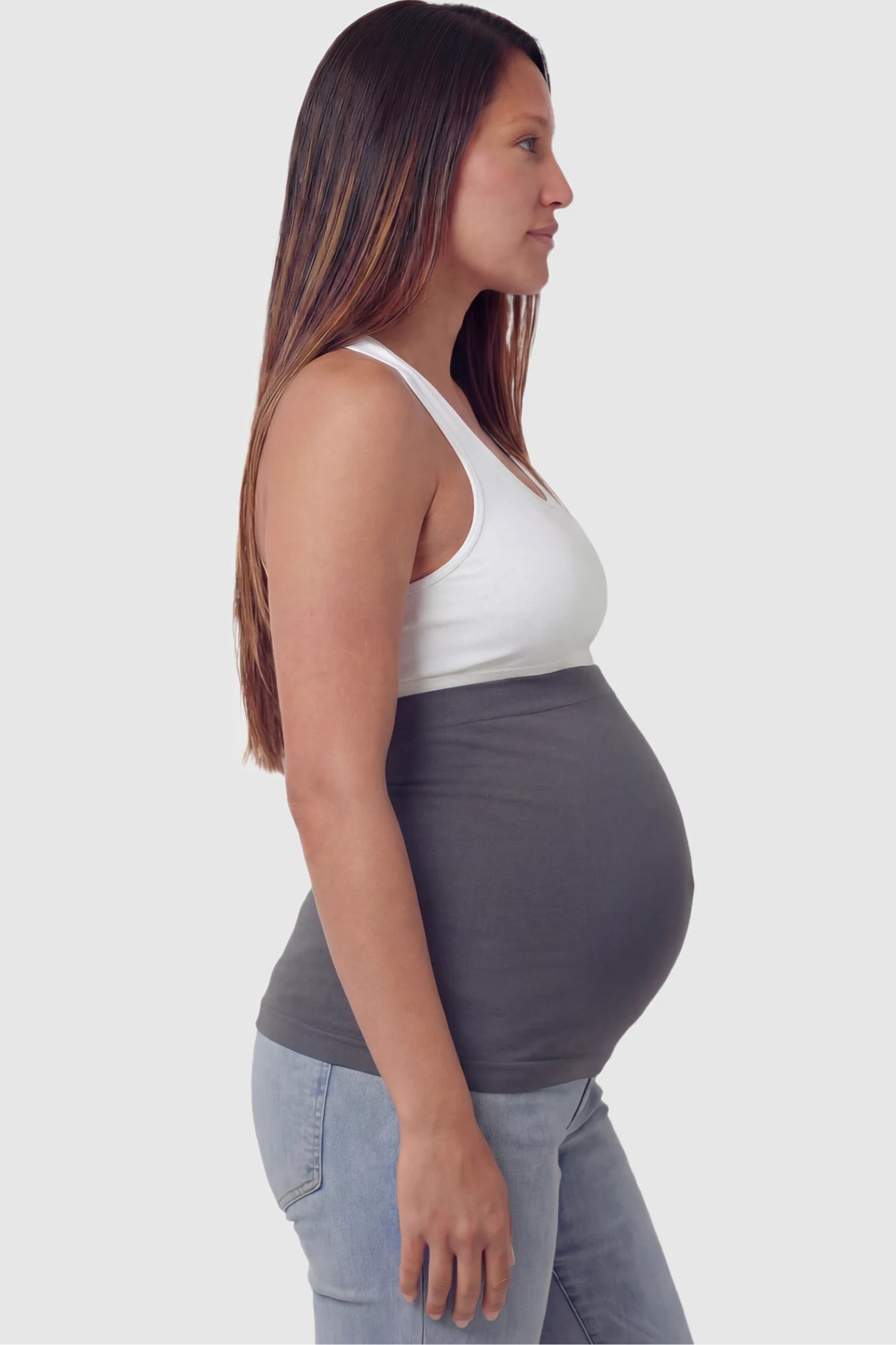 Seamless Support Maternity Belly Band Seamless Support Maternity Belly Band in dark gray featuring wide high-rise fit and seamless tubular design on pregnant model.