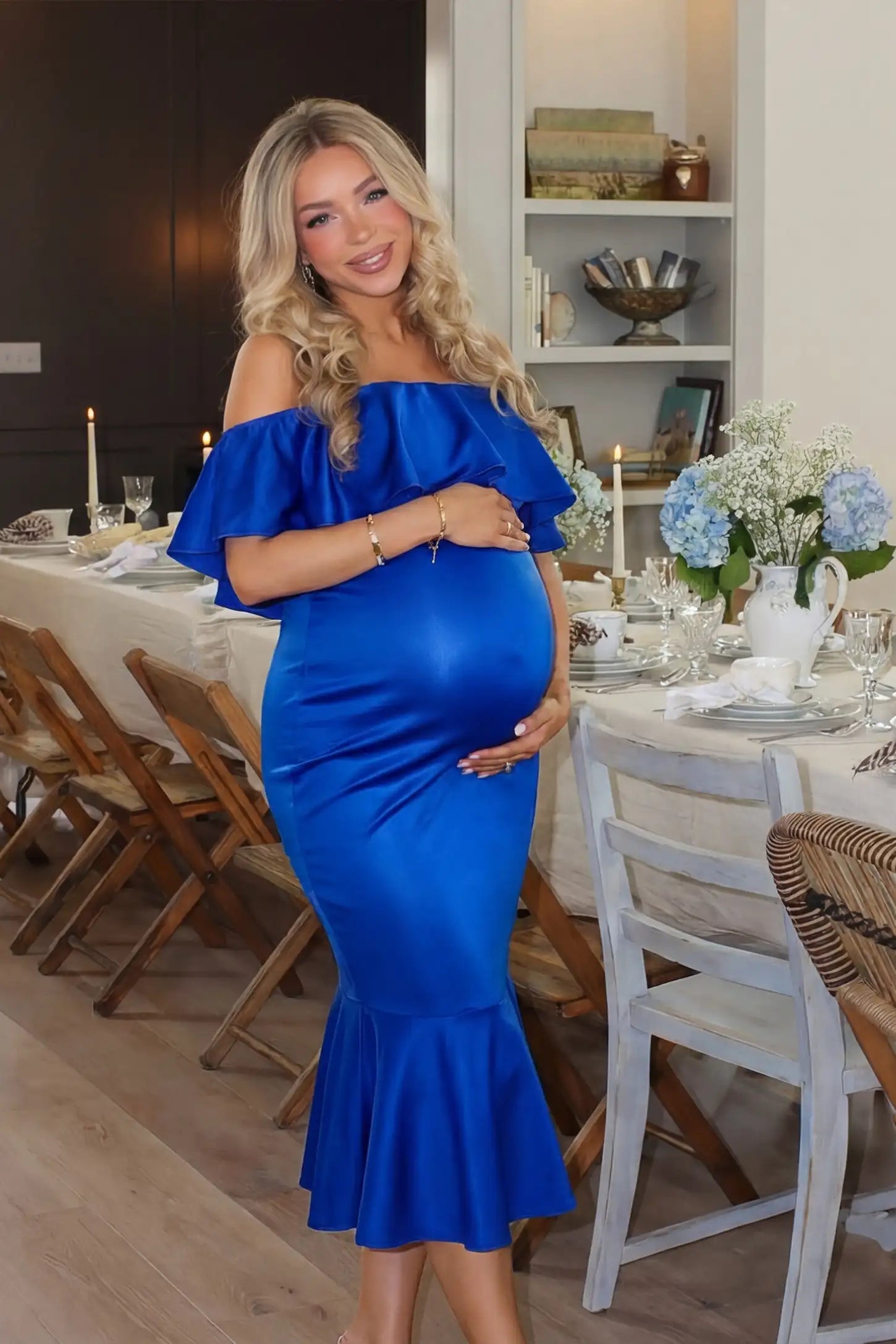 Ruffled Off-Shoulder Mermaid Hem Midi Maternity Dress Ruffled off-shoulder mermaid hem midi maternity dress in dark blue featuring retro-inspired ruffles in front view on a UGC model