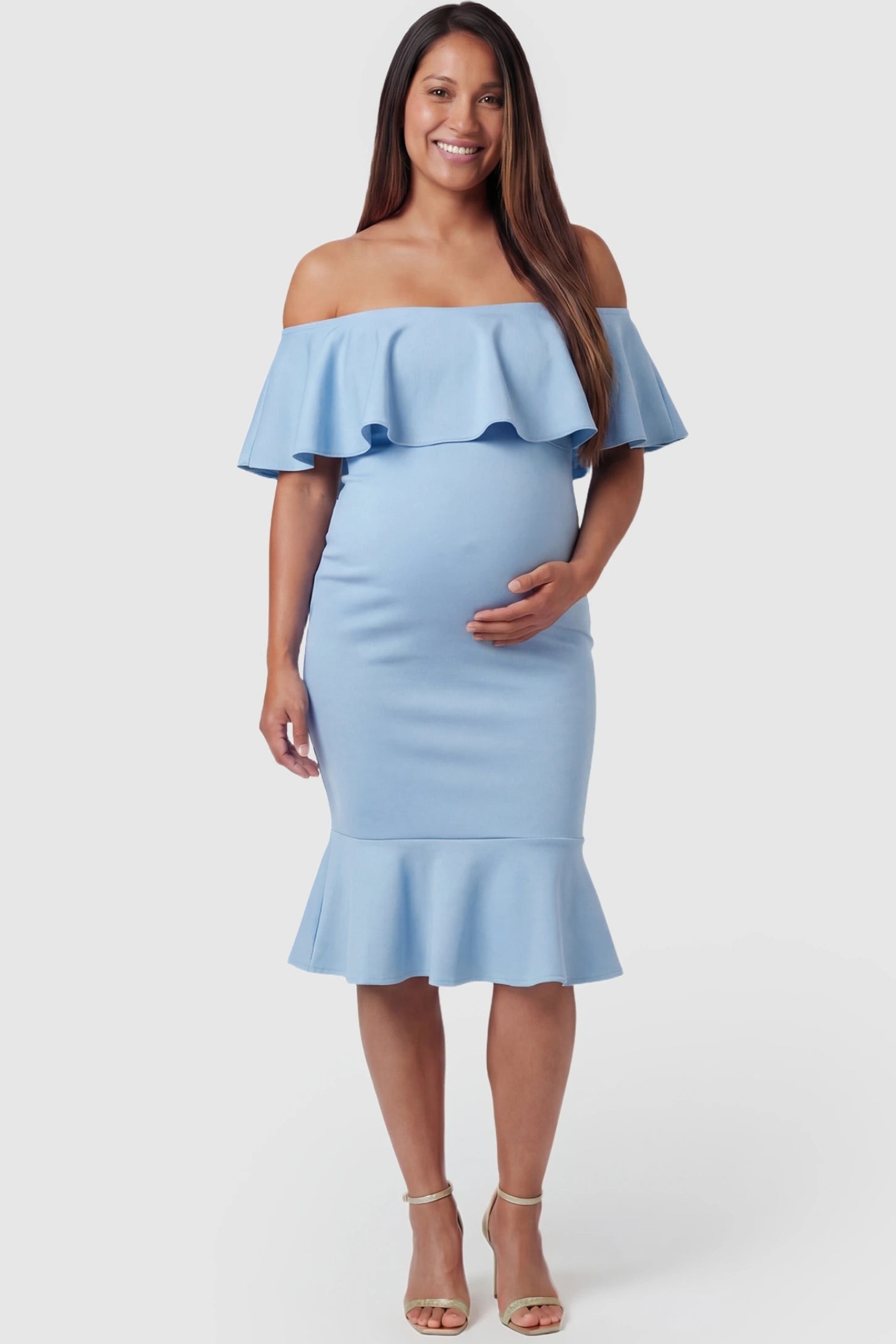 Ruffled Off-Shoulder Mermaid Hem Midi Maternity Dress Ruffled off-shoulder mermaid hem midi maternity dress in light blue featuring retro-inspired ruffles in front view on a pregnant model