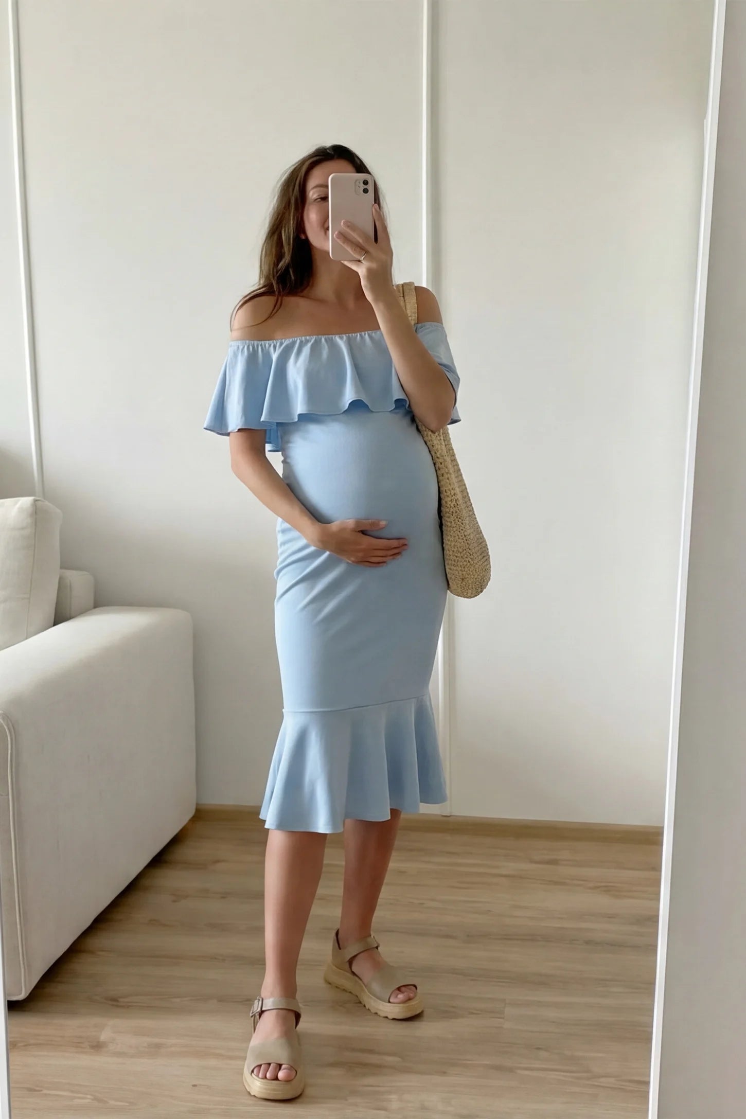 Ruffled Off-Shoulder Mermaid Hem Midi Maternity Dress Ruffled off-shoulder mermaid hem midi maternity dress in light blue featuring retro-inspired ruffles in front view on a UGC model