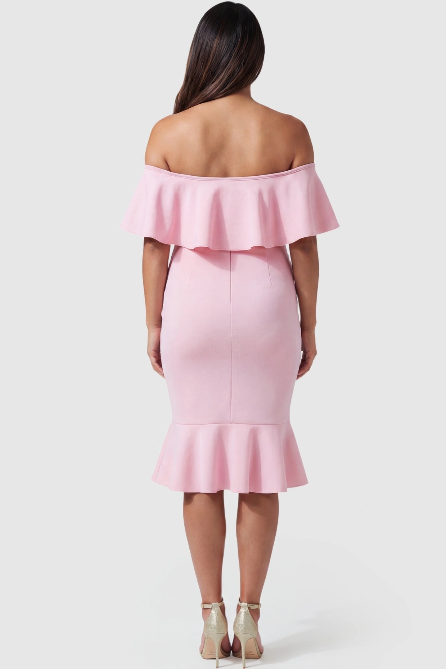 Ruffled Off-Shoulder Mermaid Hem Midi Maternity Dress Ruffled off-shoulder mermaid hem midi maternity dress in pink featuring elegant back ruffle detail in back view on a pregnant model