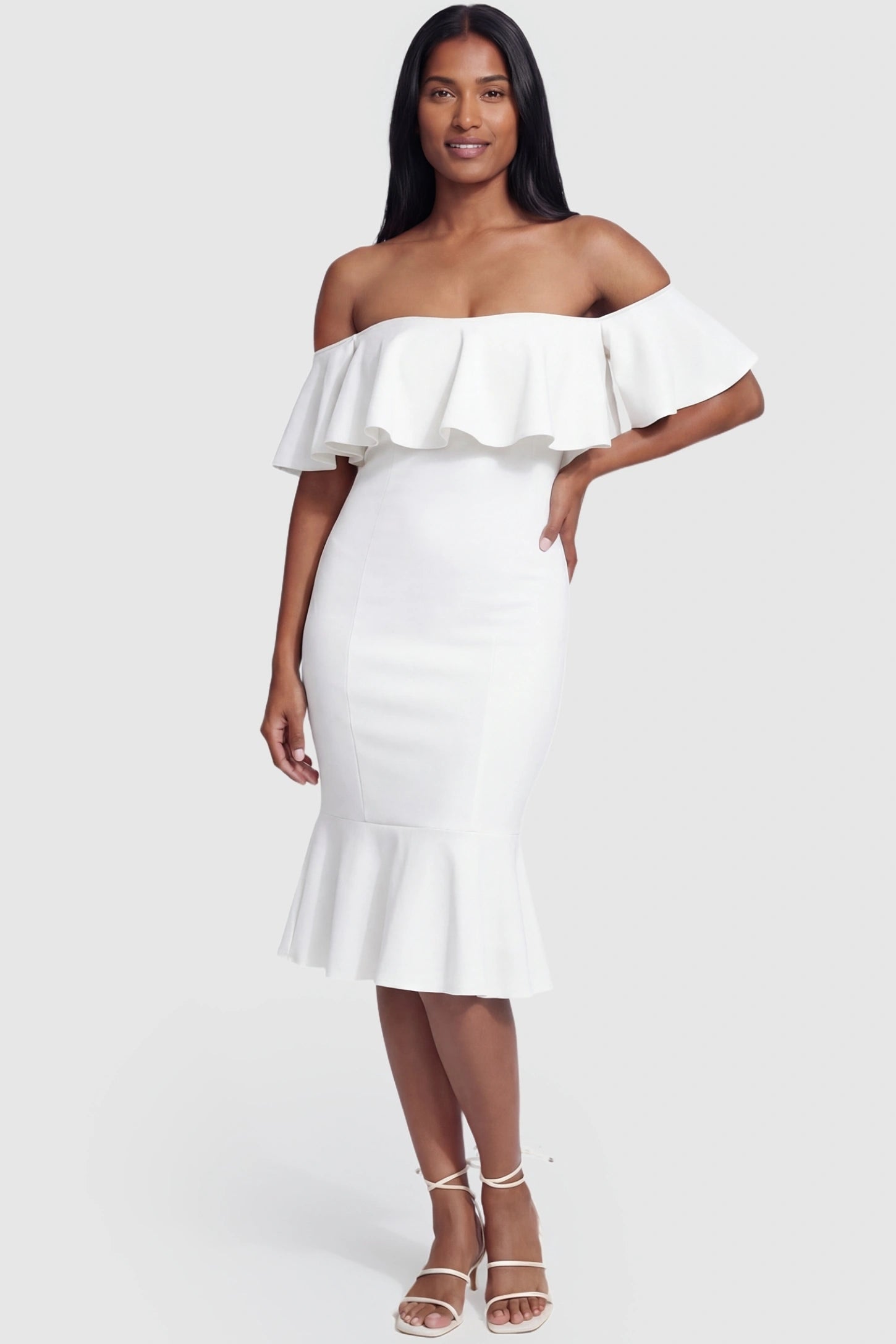 Ruffled Off-Shoulder Mermaid Hem Midi Maternity Dress Ruffled off-shoulder mermaid hem midi maternity dress in white featuring flattering sculpted silhouette in full body view on a postpartum model