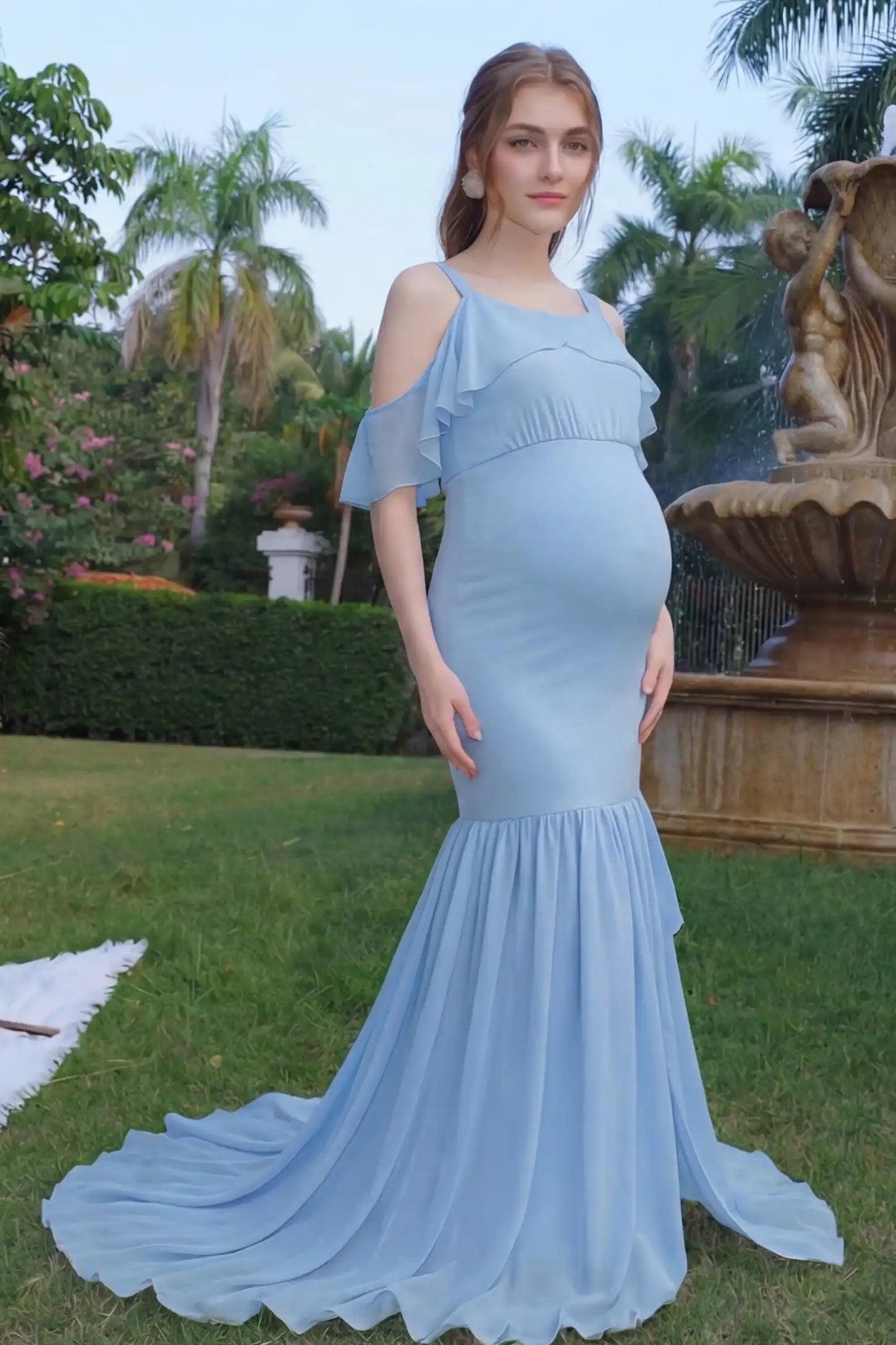 Off-Shoulder Flutter Sleeve Mermaid Trailing Maxi Maternity Dress Off-shoulder flutter sleeve mermaid trailing maxi maternity dress in light blue with flowing trailing train, on UGC model