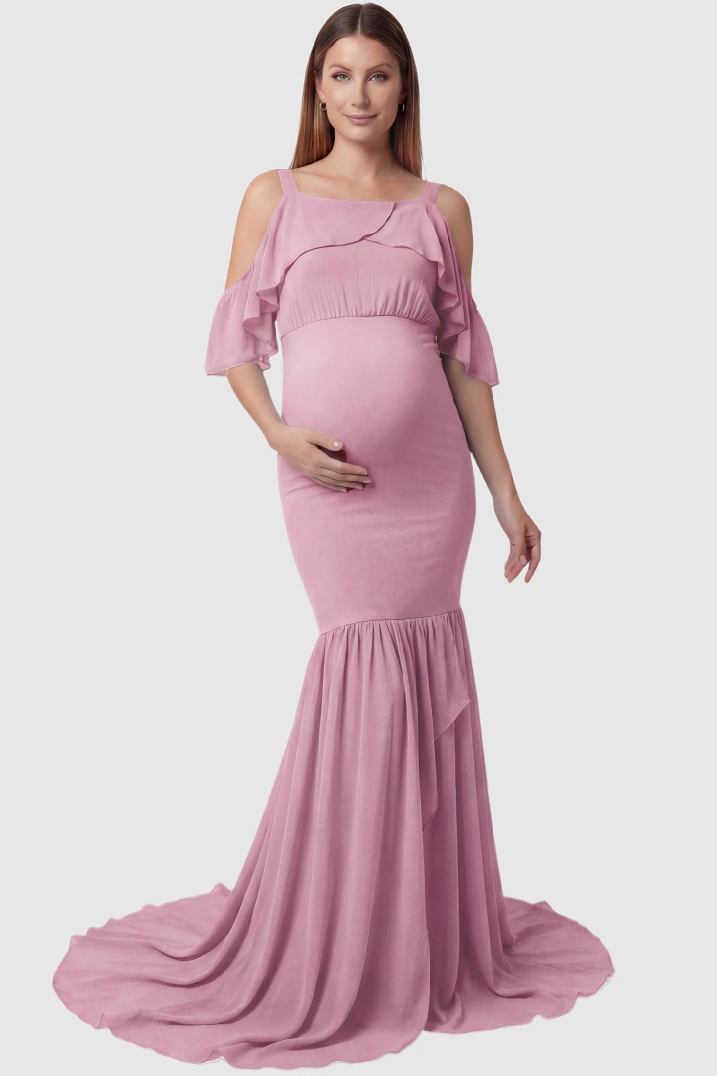 Off-Shoulder Flutter Sleeve Mermaid Trailing Maxi Maternity Dress Off-shoulder flutter sleeve mermaid trailing maxi maternity dress in pink featuring romantic off-shoulder neckline in front view on a pregnant model