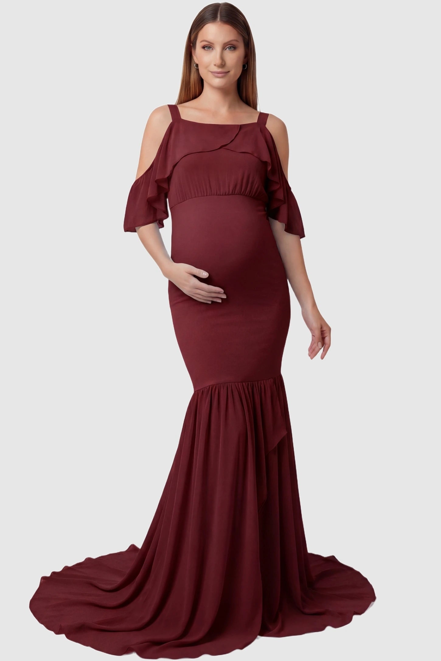 Off-Shoulder Flutter Sleeve Mermaid Trailing Maxi Maternity Dress Off-shoulder flutter sleeve mermaid trailing maxi maternity dress in wine red featuring romantic off-shoulder neckline in front view on a pregnant model