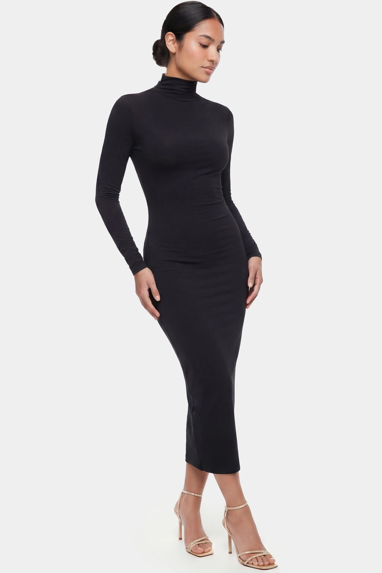 Fitted Long Sleeve Mock Neck Maxi Maternity Dress Fitted long sleeve mock neck maxi maternity dress in black with stretchy fabric, full body on postpartum model