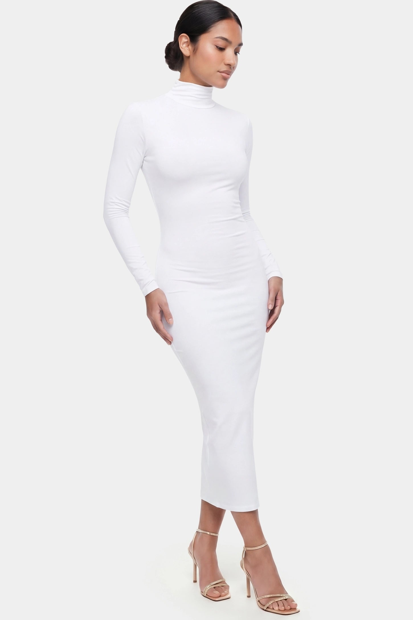 Fitted Long Sleeve Mock Neck Maxi Maternity Dress Fitted long sleeve mock neck maxi maternity dress in white with stretchy fabric, full body on postpartum model
