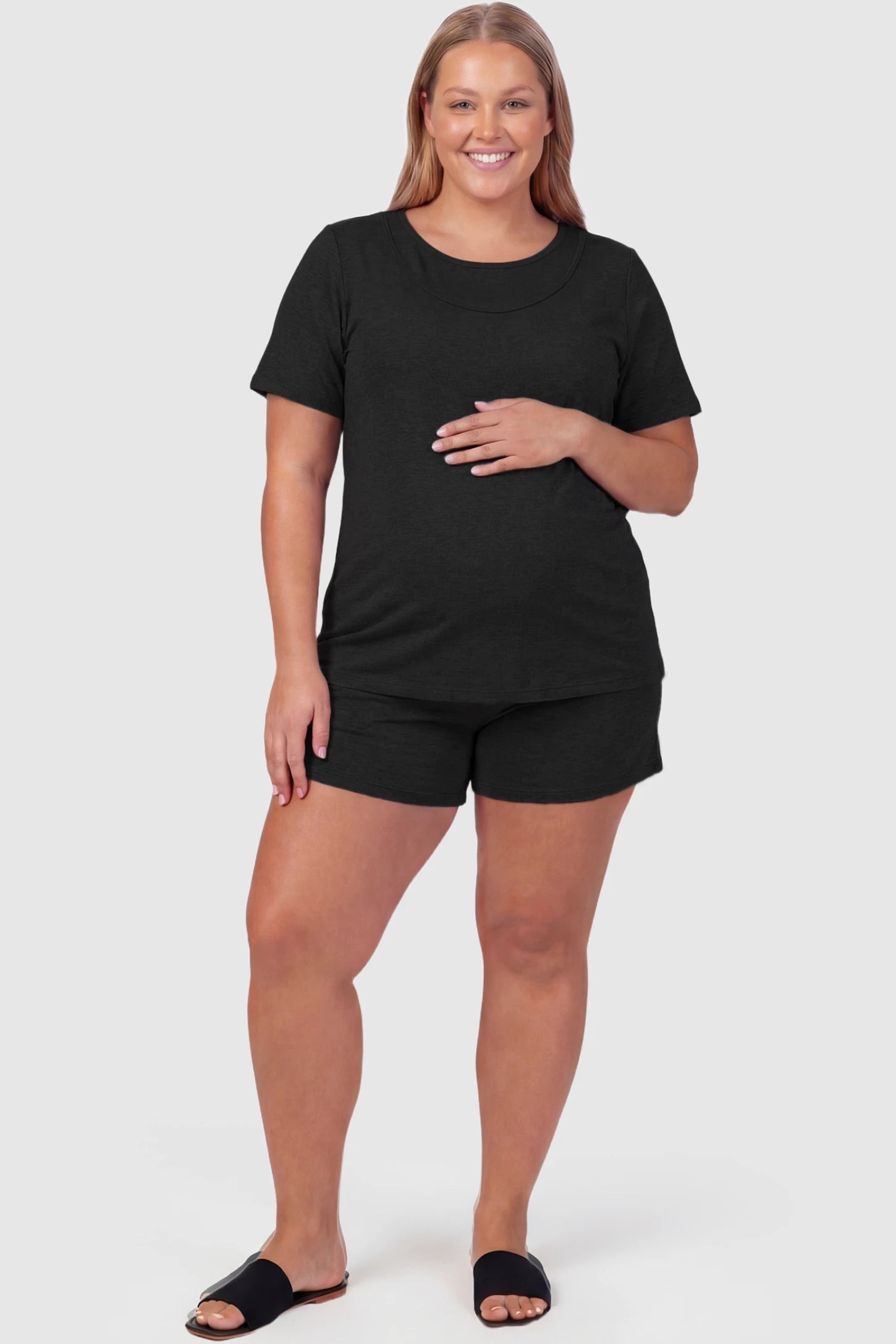 Modal Short Sleeve Maternity & Nursing Lounge Set Modal Short Sleeve Maternity Lounge Set in black featuring round-neck top, and relaxed shorts on plus size pregnant model.