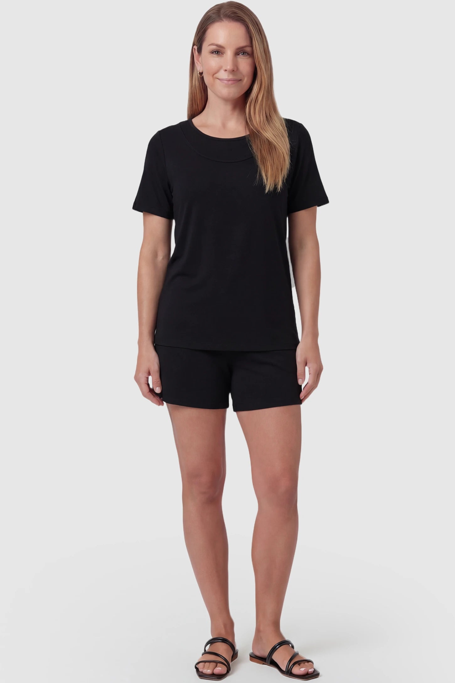 Modal Short Sleeve Maternity & Nursing Lounge Set Modal Short Sleeve Maternity Lounge Set in black featuring round-neck top, and relaxed shorts on non pregnant model.