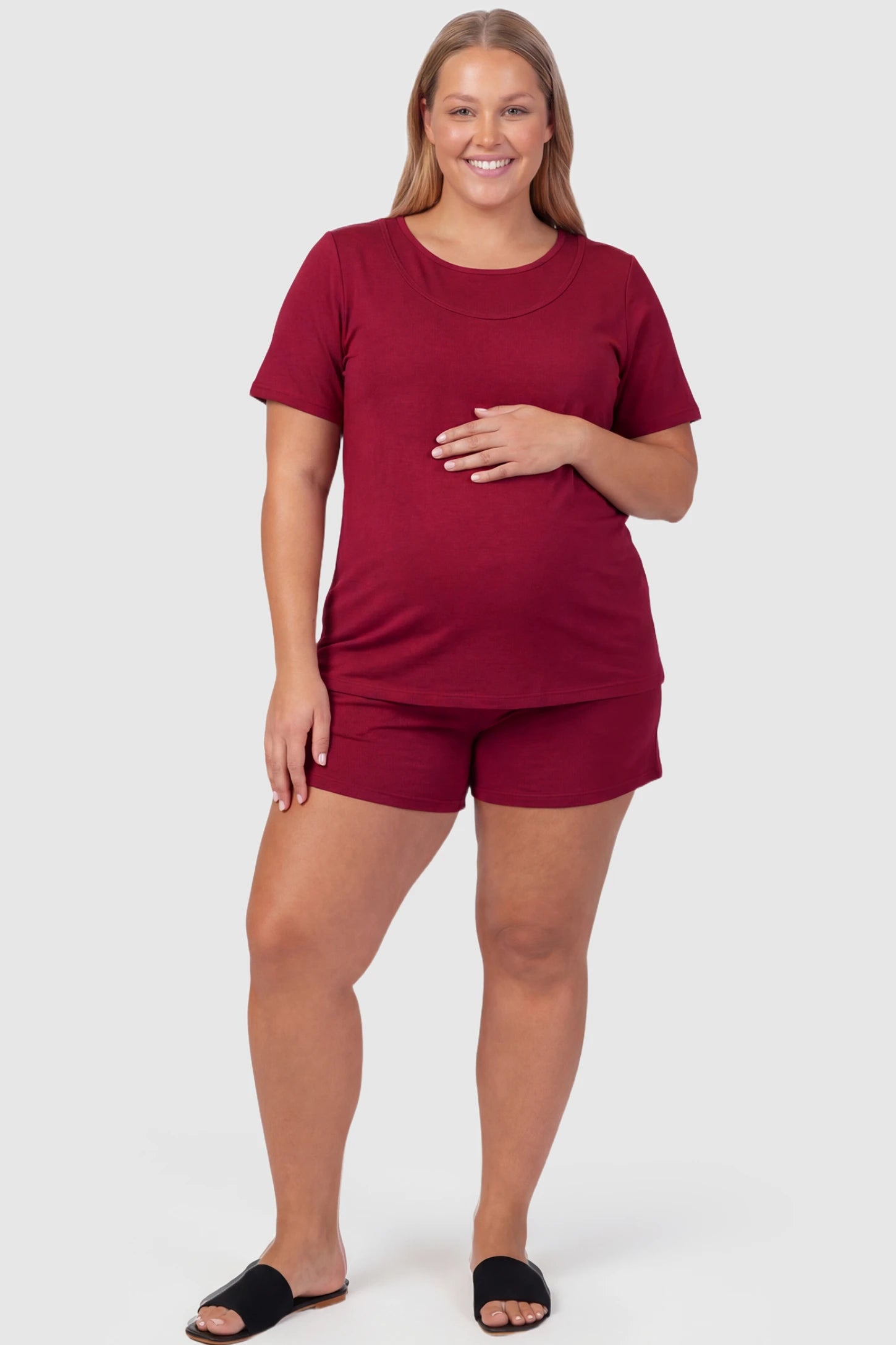 Modal Short Sleeve Maternity & Nursing Lounge Set  Modal Short Sleeve Maternity Lounge Set in burgundy featuring round-neck top, and relaxed shorts on plus size pregnant model.