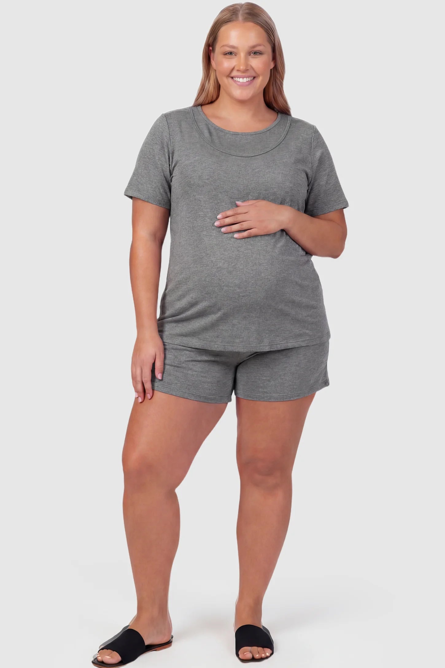 Modal Short Sleeve Maternity & Nursing Lounge Set Modal Short Sleeve Maternity Lounge Set in gray featuring round-neck top, and relaxed shorts on plus size pregnant model.