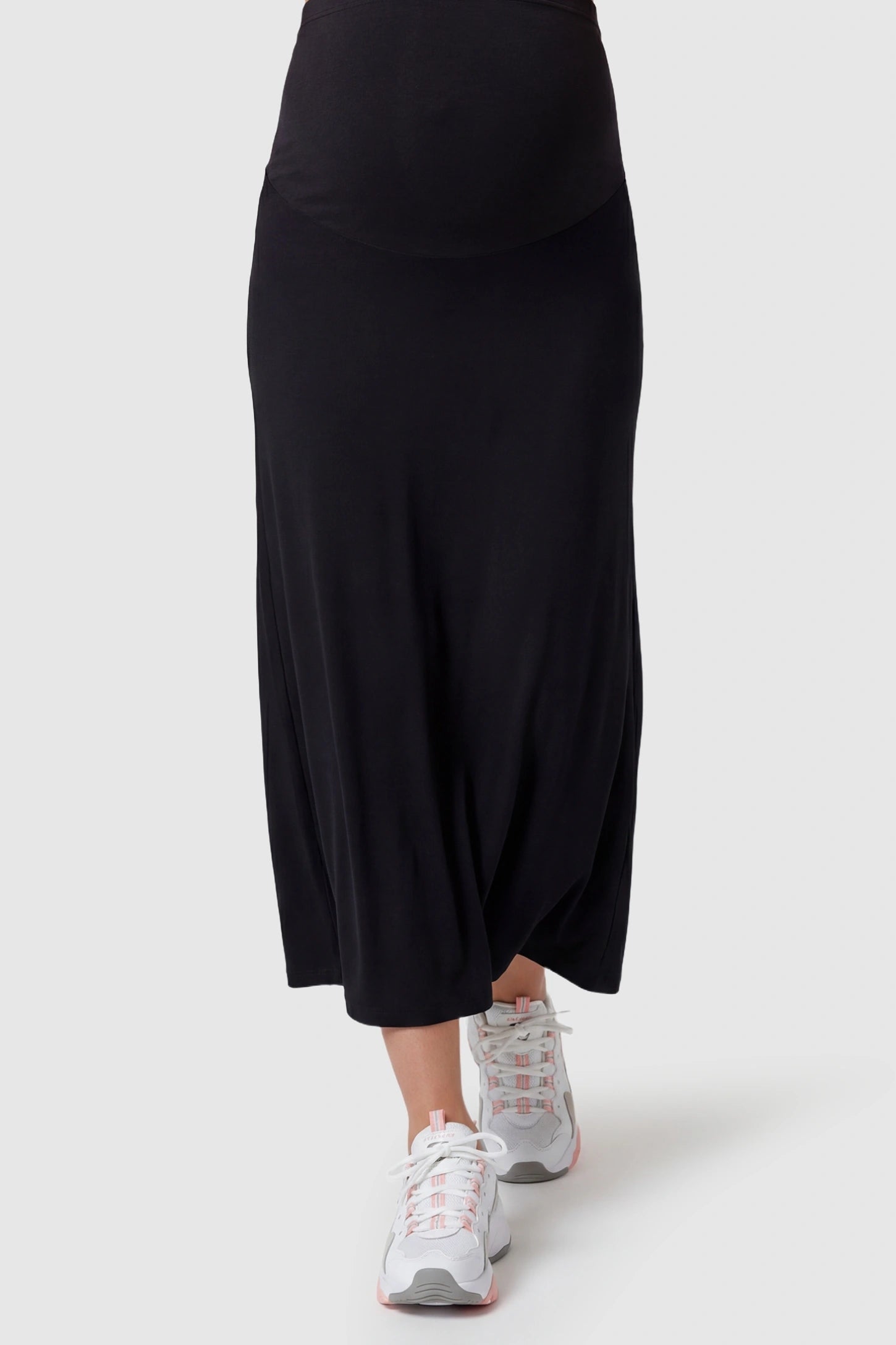 Modal High Waist A-Line Maternity Maxi Skirt Modal High Waist A-Line Maternity Maxi Skirt in Black featuring soft modal fabric on a pregnant model, front view.