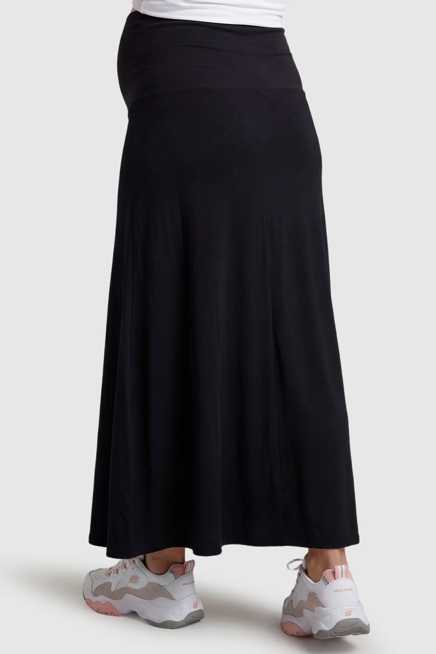 Modal High Waist A-Line Maternity Maxi Skirt Modal High Waist A-Line Maternity Maxi Skirt in Black featuring a flowing A-line silhouette on a pregnant model, back view.