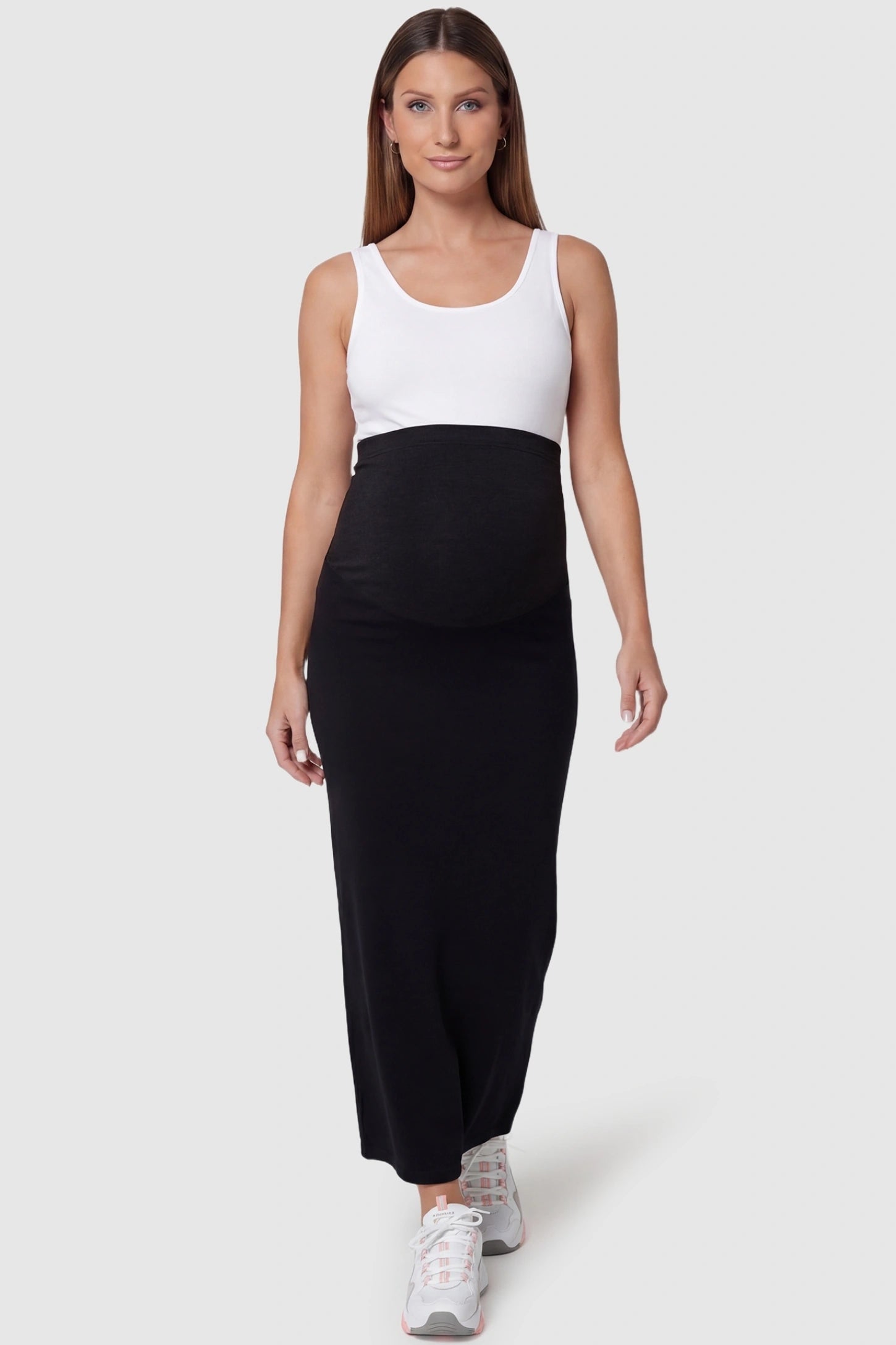 Modal High Waist A-Line Maternity Maxi Skirt in Black featuring a smoothing belly band on a pregnant model, full body view.