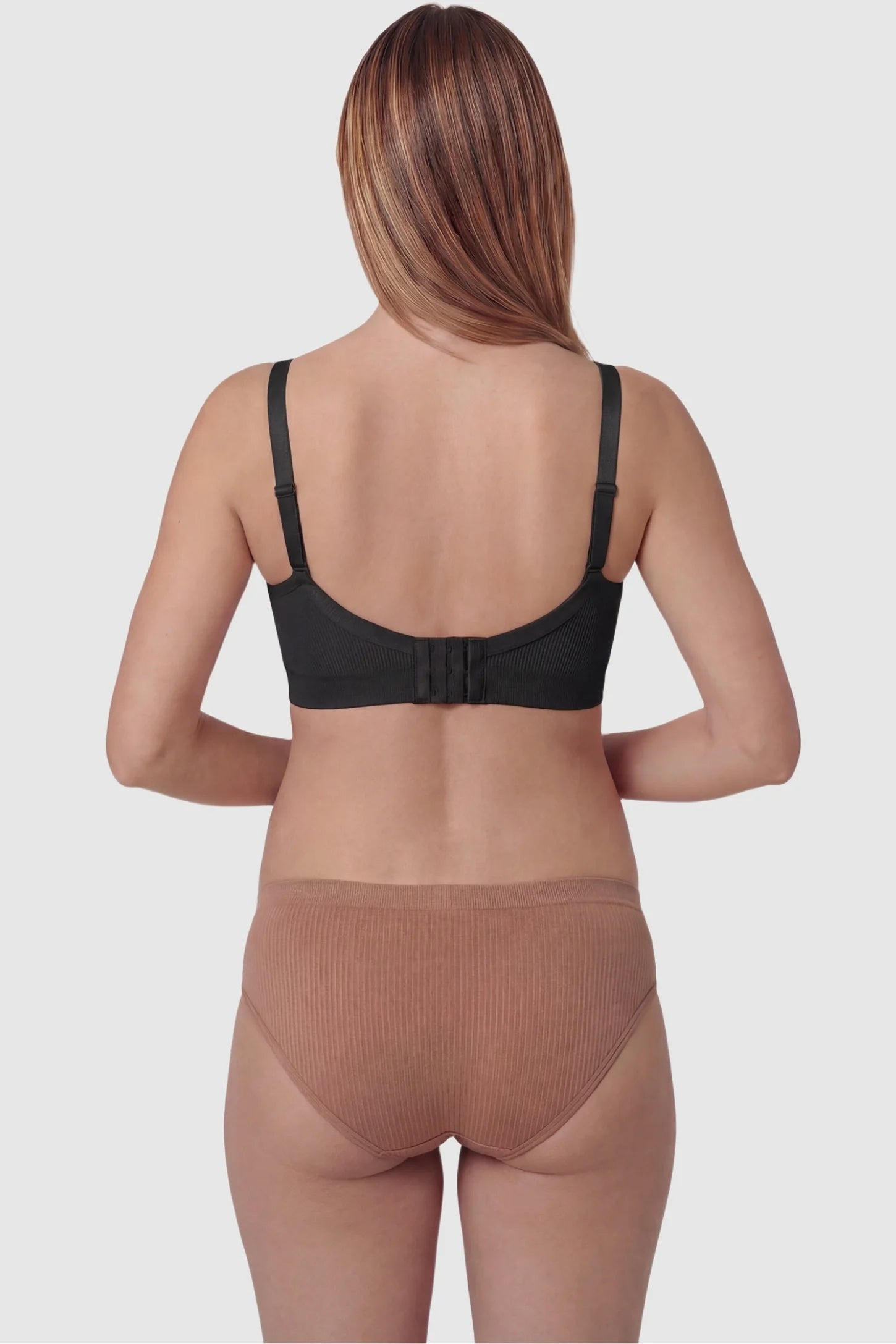 Ribbed Wireless Adjustable Shoulder Strap Nursing Bra Ribbed wireless adjustable strap nursing bra in black with wire-free support, back view on pregnant model
