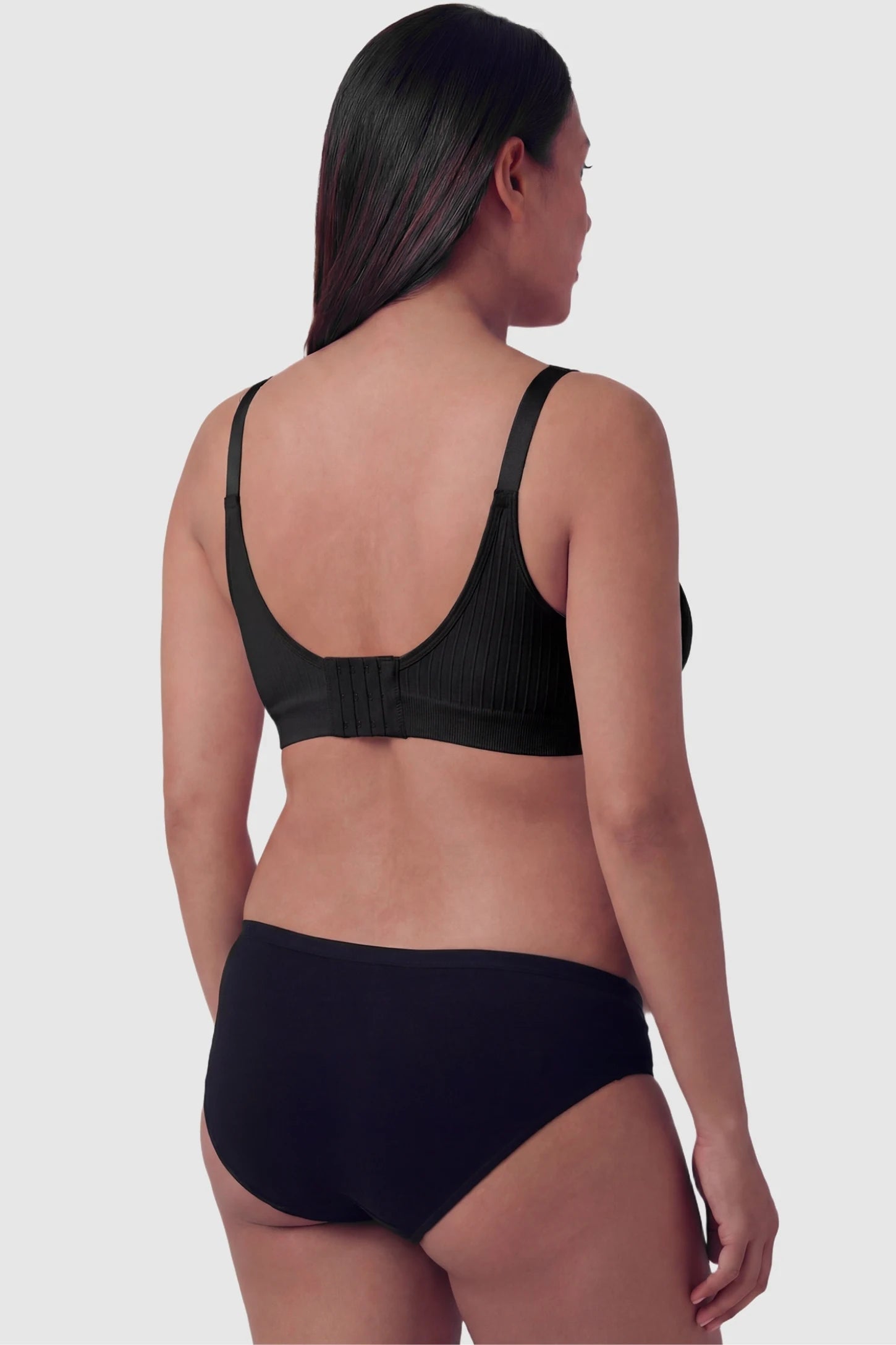 Seamless Front-Open Cross Wireless Nursing Bra Seamless front-open cross wireless nursing bra in black with wire-free design, back view on pregnant model