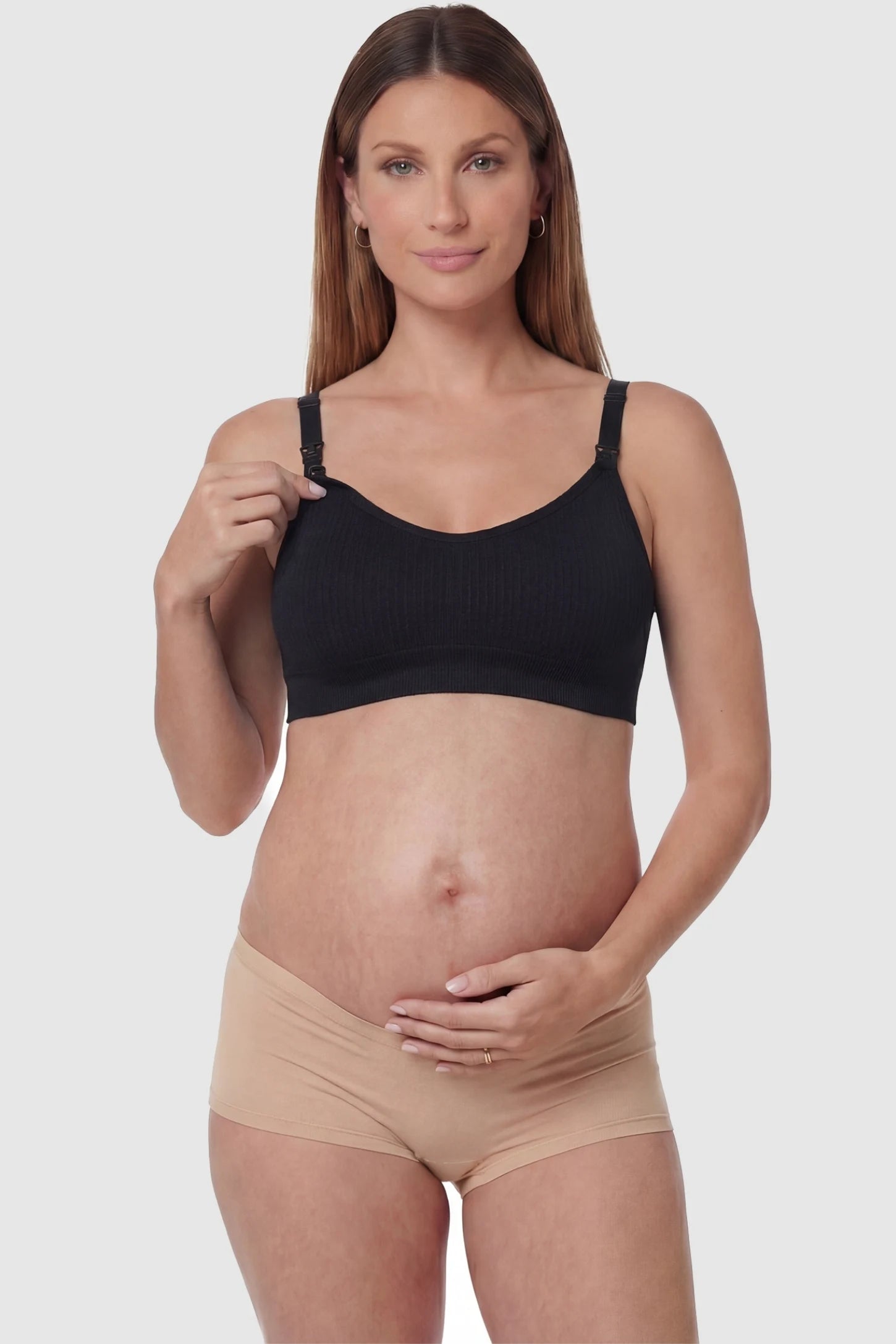 Full-Flap Seamless Top-Opening Nursing Bra Full-flap seamless top-opening nursing bra in black with one-hand access, front view on function demo model