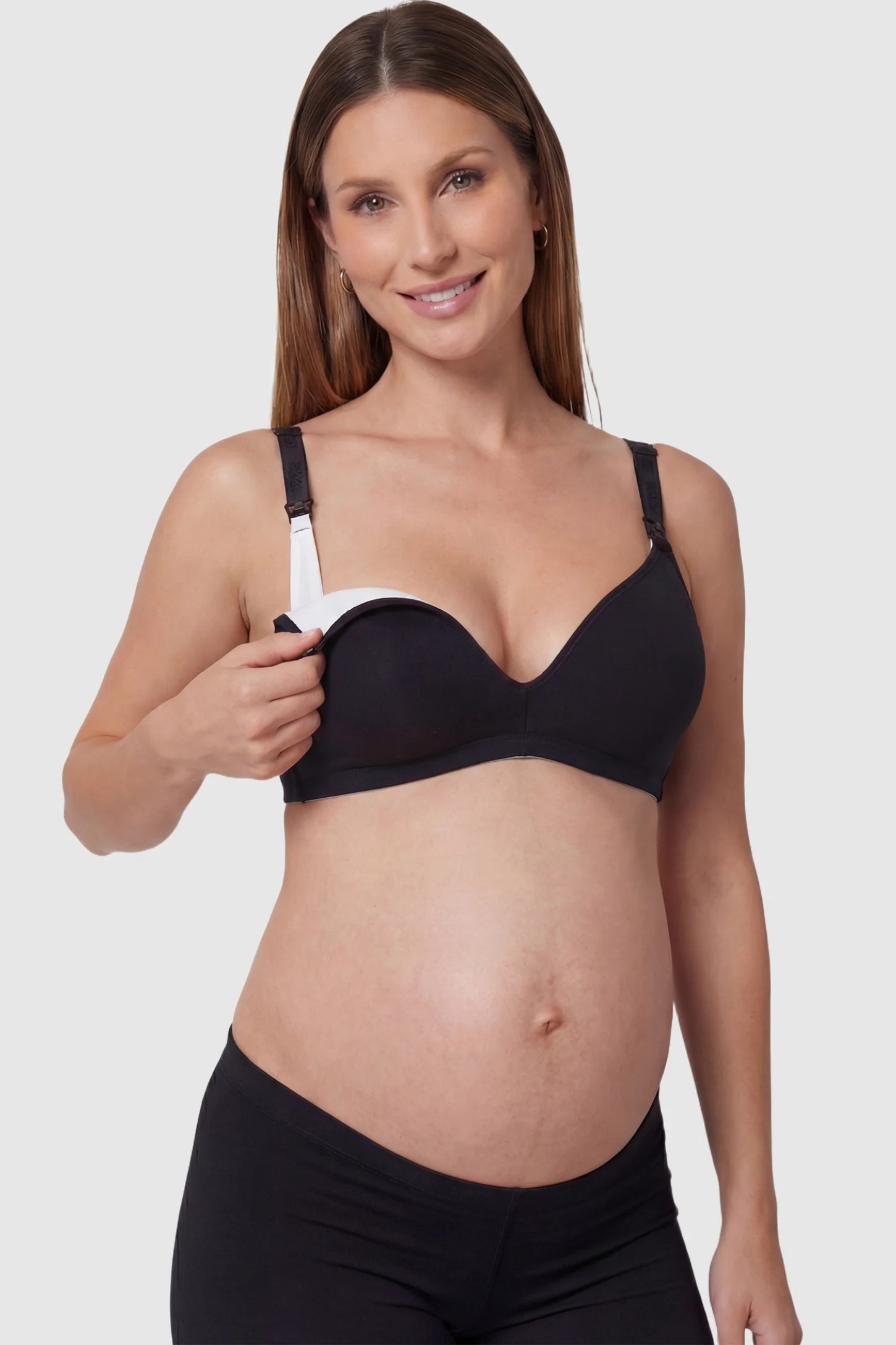 Wireless Medium Molded Cup Open-Clasp Nursing Bra Wireless medium molded cup open-clasp nursing bra in black with open-clasp design, front view on function detail model