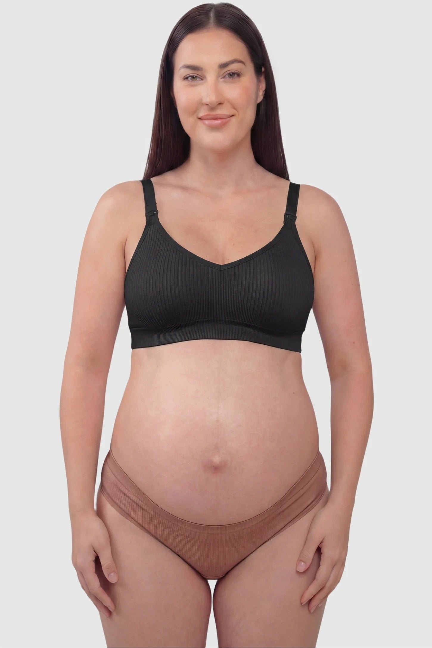 Ribbed Wireless Adjustable Shoulder Strap Nursing Bra Ribbed wireless adjustable strap nursing bra in black with stretchy fabric, front view on plus-size model