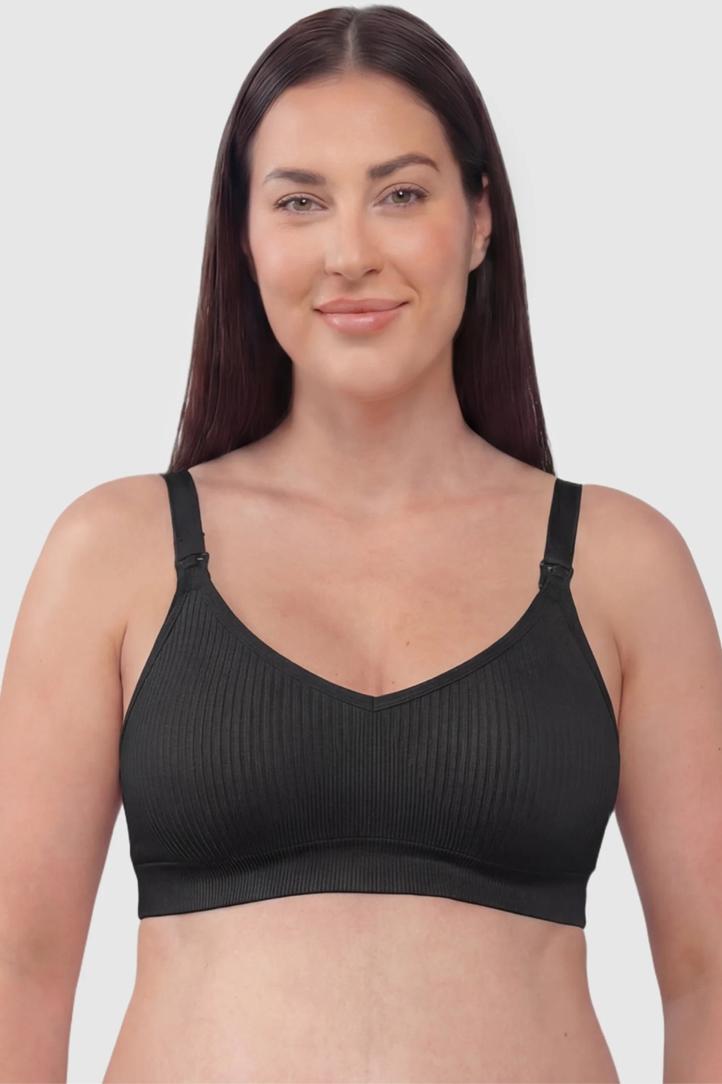 Ribbed Wireless Adjustable Shoulder Strap Nursing Bra Ribbed wireless adjustable strap nursing bra in black with stretchy fabric, front view on plus-size model