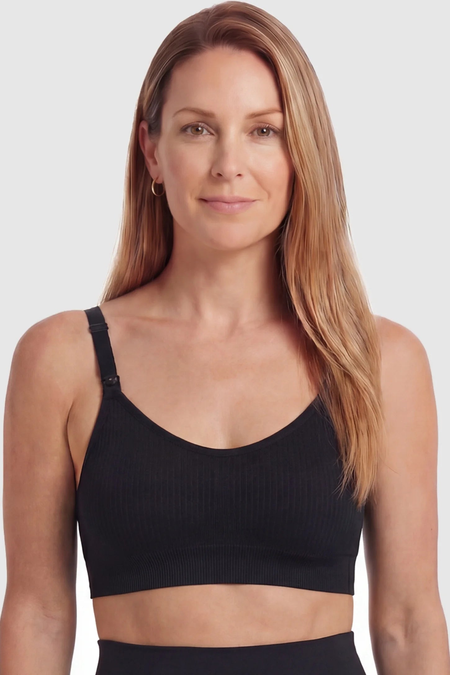 Full-Flap Seamless Top-Opening Nursing Bra Full-flap seamless top-opening nursing bra in black with breathable anti-leakage design, full body on postpartum model