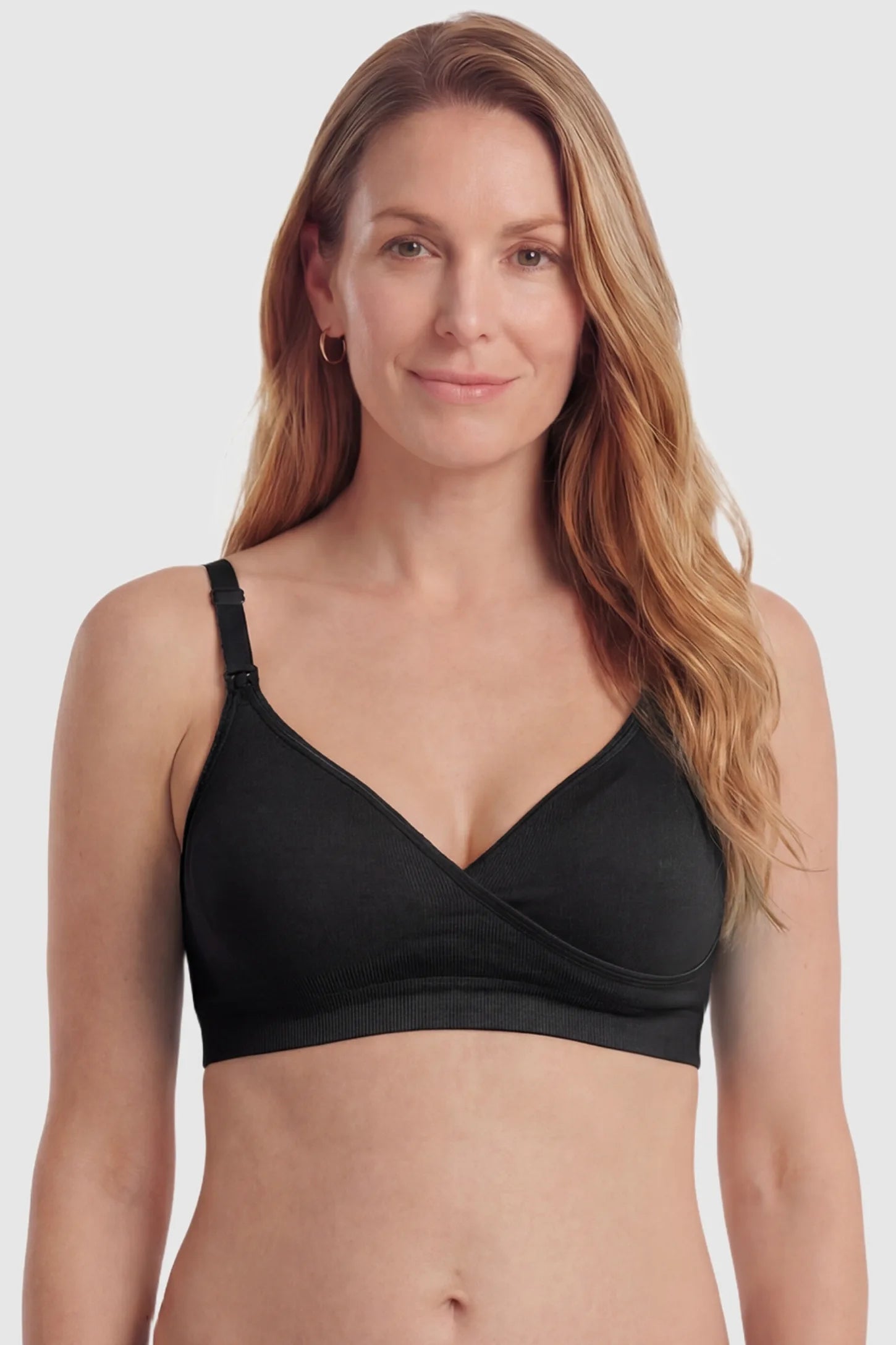 Seamless Front-Open Cross Wireless Nursing Bra Seamless front-open cross wireless nursing bra in black with flexible support, full body on postpartum model