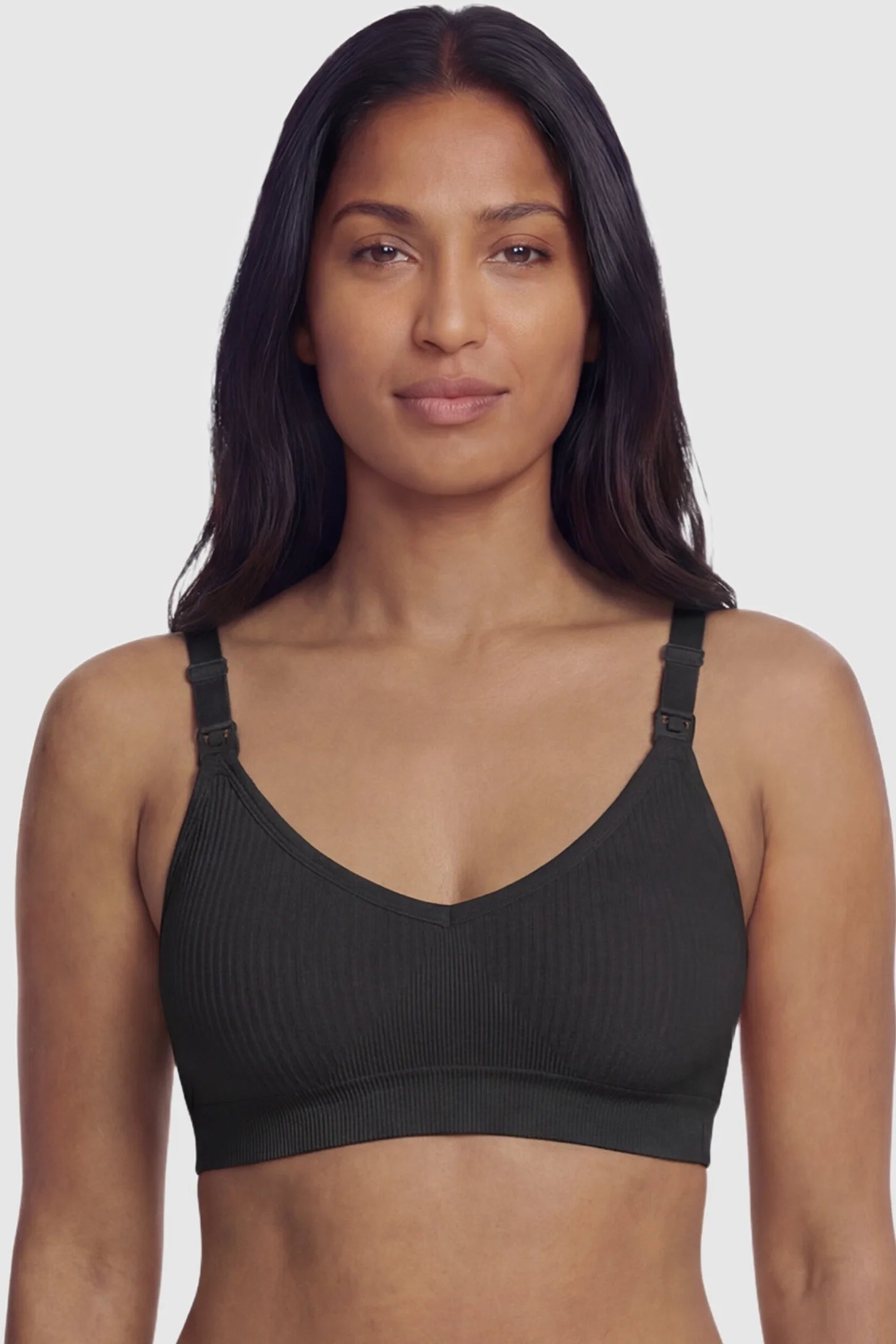 Ribbed Wireless Adjustable Shoulder Strap Nursing Bra Ribbed wireless adjustable strap nursing bra in black with stretchy fabric, front view on postpartum model