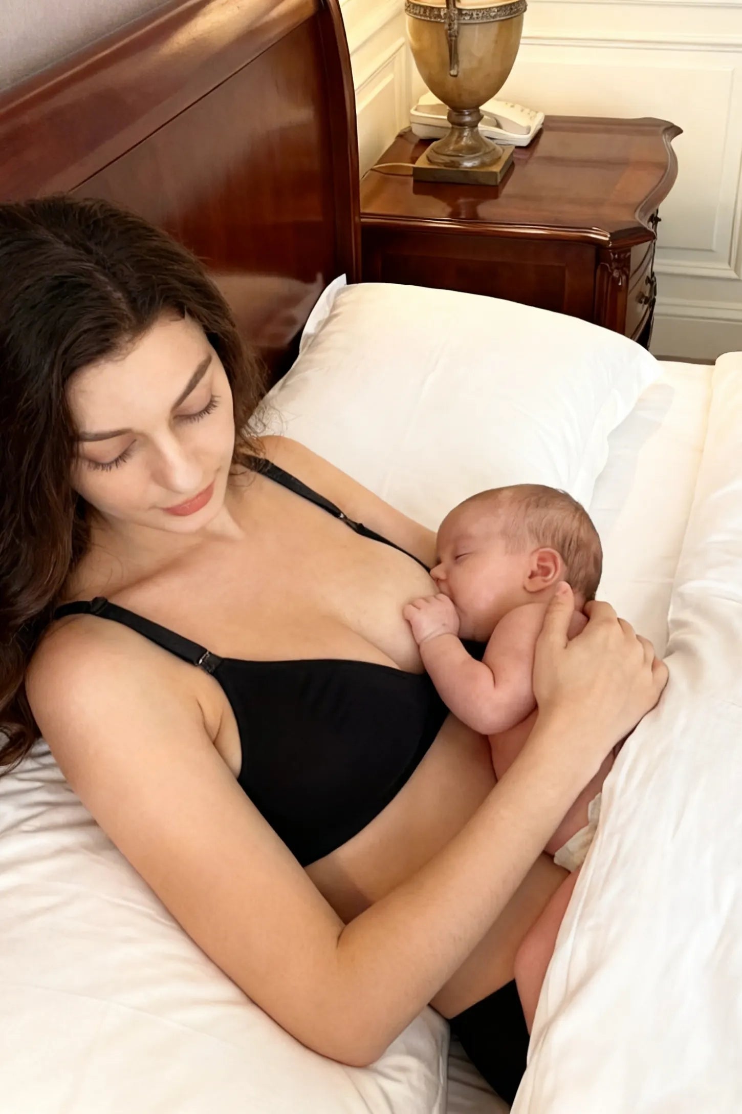 Wireless Medium Molded Cup Open-Clasp Nursing Bra Wireless medium molded cup open-clasp nursing bra in black with soft stretch fit, full body on UGC model