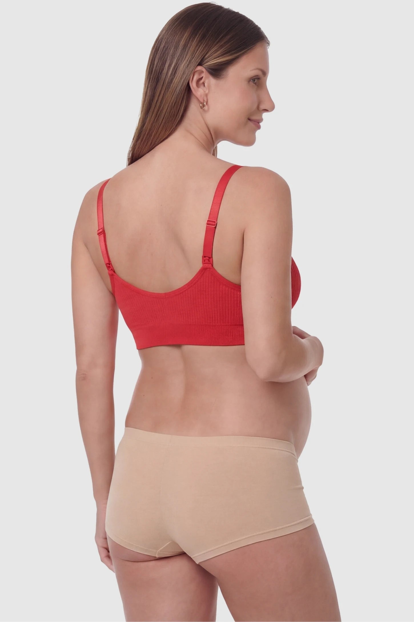 Full-Flap Seamless Top-Opening Nursing Bra Full-flap seamless top-opening nursing bra in bright red with invisible back buckle, back view on pregnant model