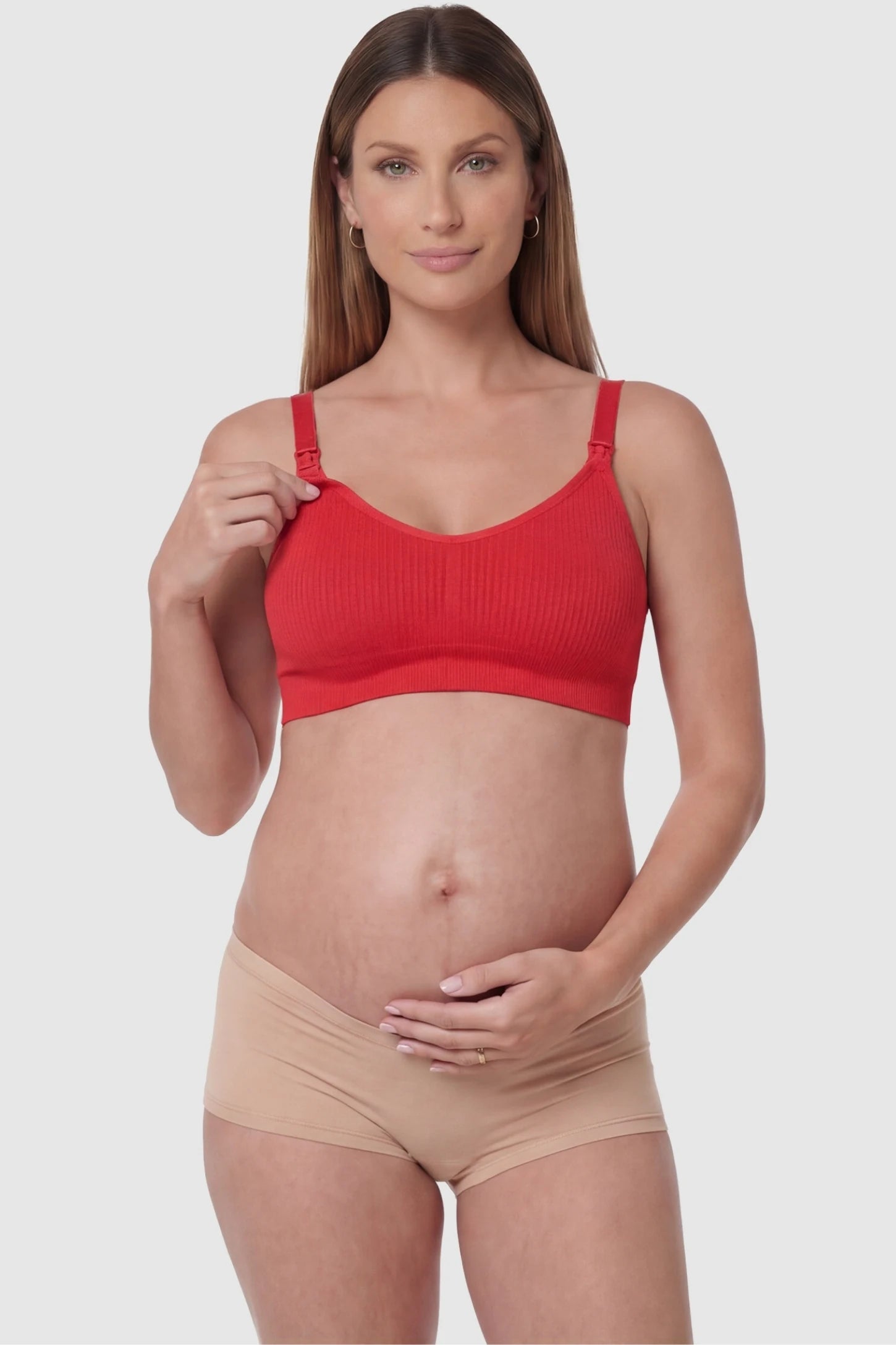 Full-Flap Seamless Top-Opening Nursing Bra Full-flap seamless top-opening nursing bra in bright red with one-hand access, front view on function demo model